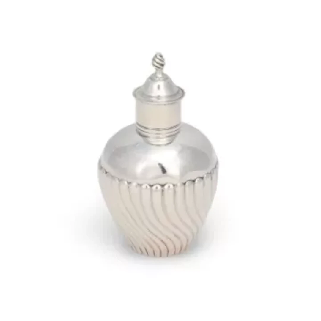 A GEORGE III SILVER TEA CADDY