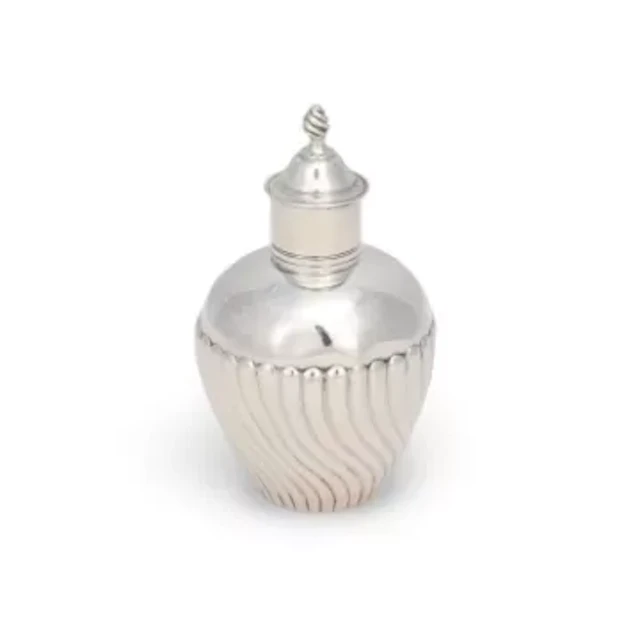 A GEORGE III SILVER TEA CADDY