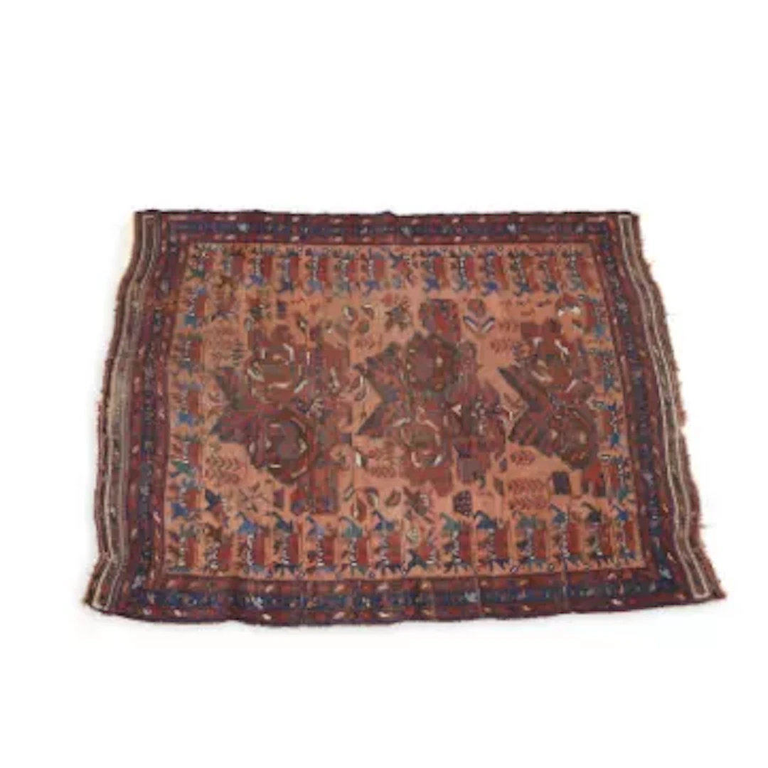 AN ANTIQUE WEST PERSIAN RUG