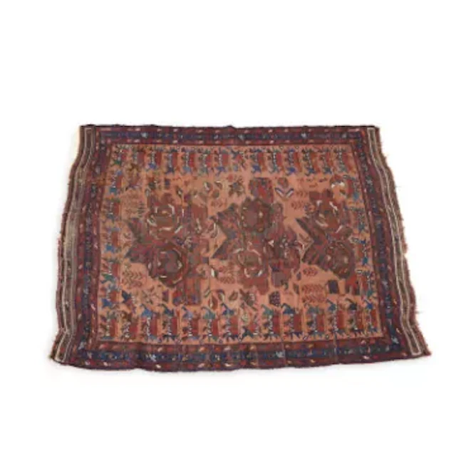 AN ANTIQUE WEST PERSIAN RUG