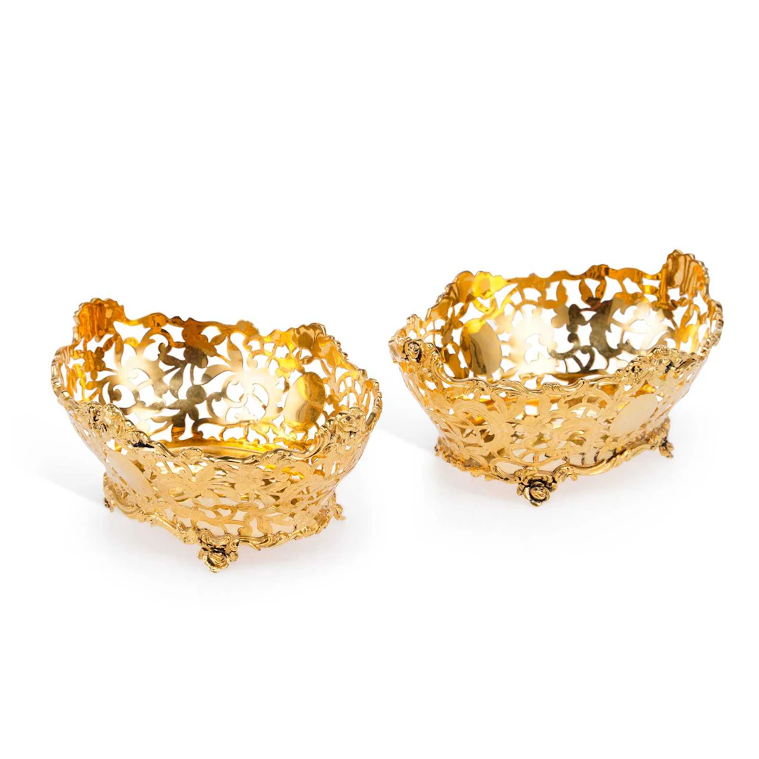 A PAIR OF GEORGE V SILVER-GILT PIERCED BASKETS