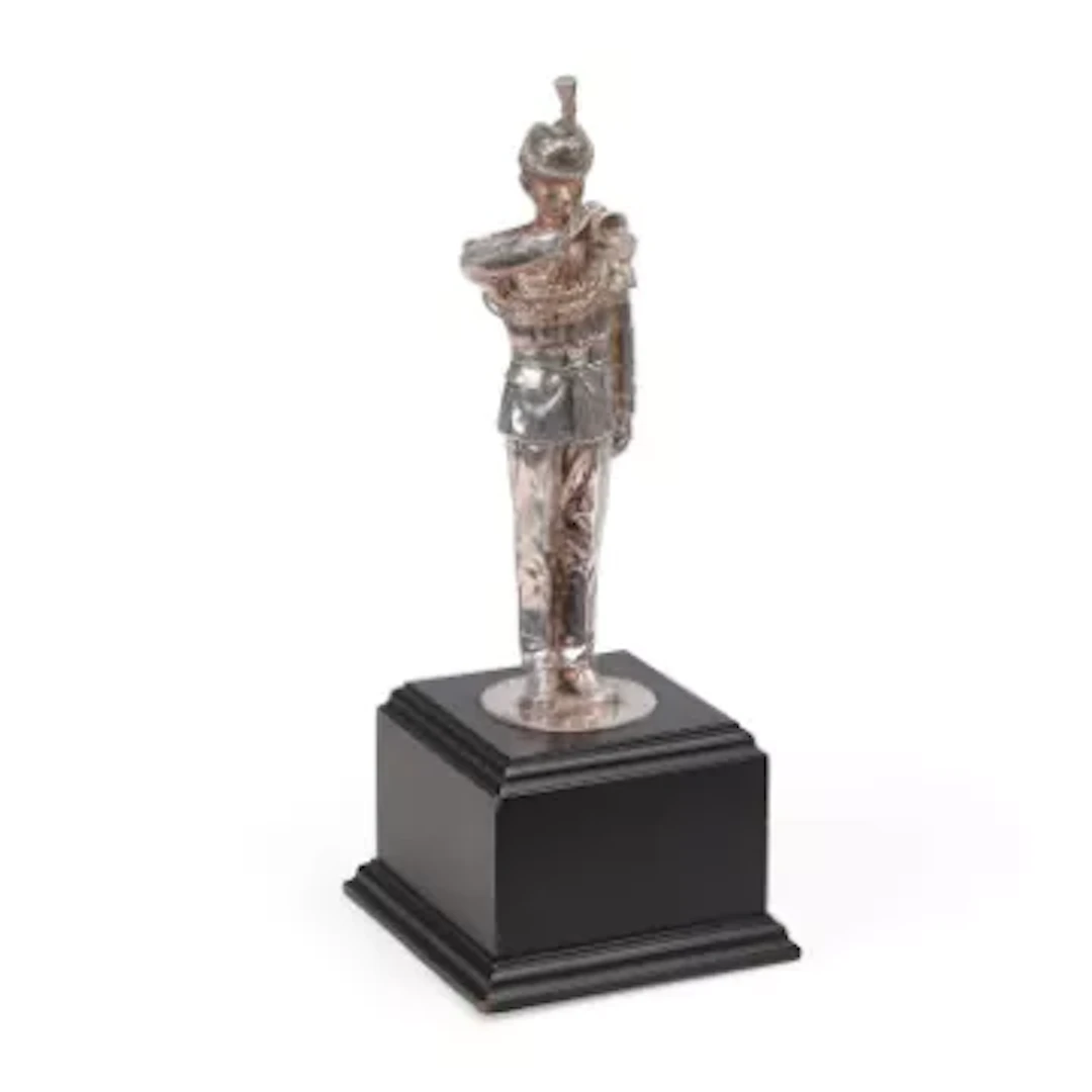 A SILVER FIGURE OF A BUGLER