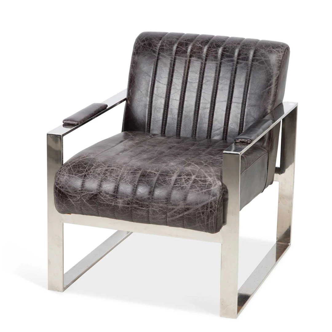 A TIMOTHY OULTON LEATHER AND CHROME ARMCHAIR