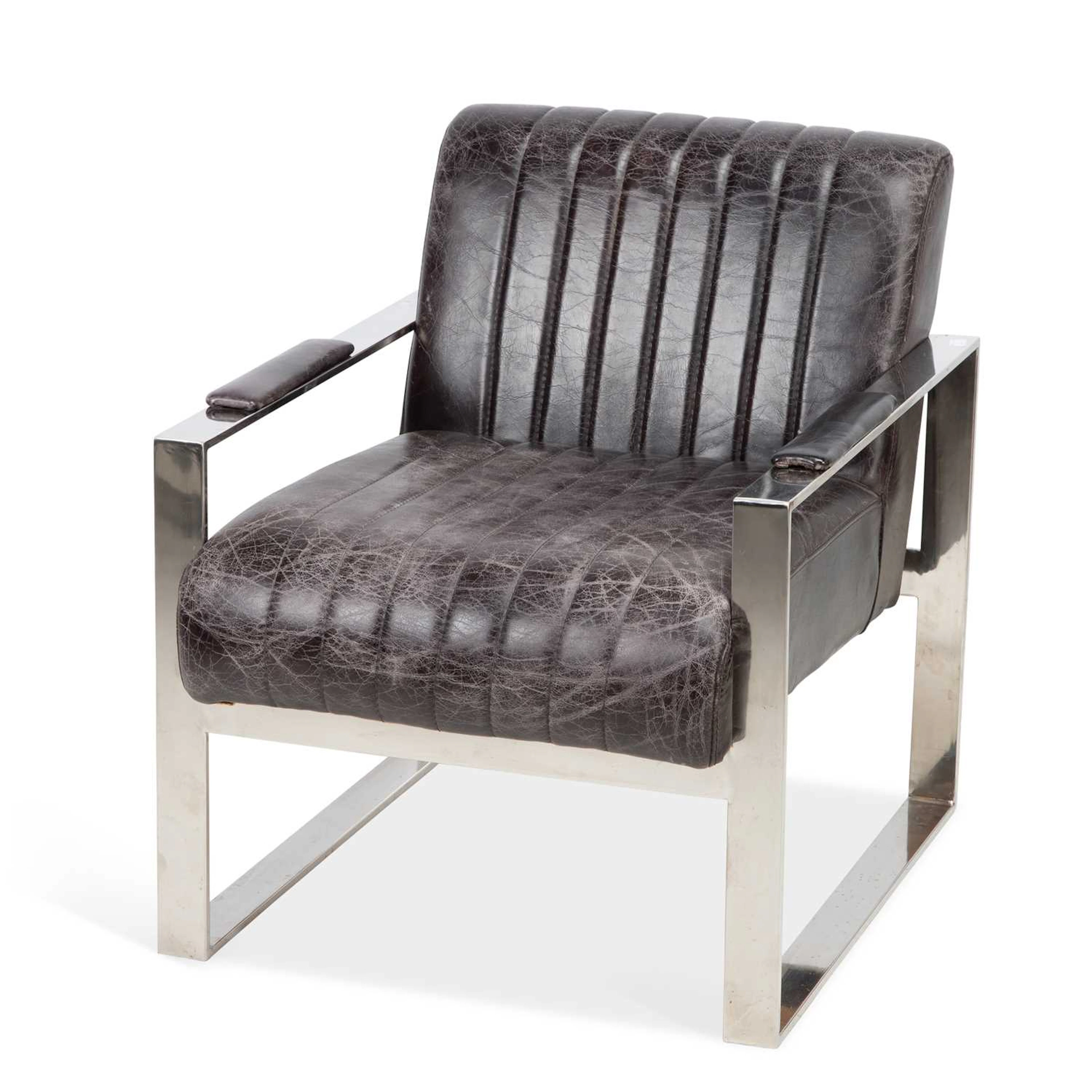 A TIMOTHY OULTON LEATHER AND CHROME ARMCHAIR