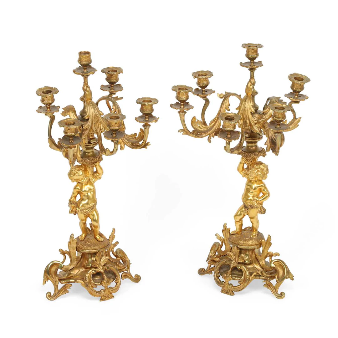 A PAIR OF FRENCH GILT BRONZE SIX-LIGHT FIGURAL CANDELABRA