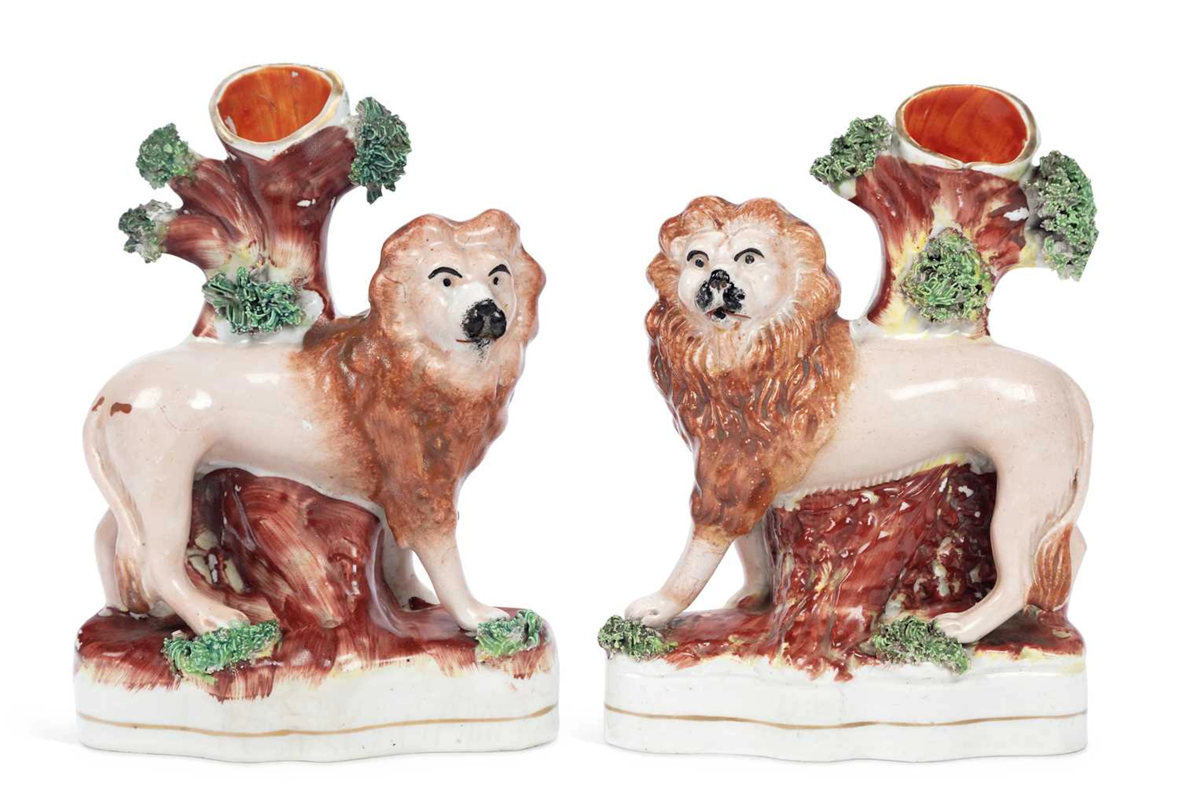 A PAIR OF STAFFORDSHIRE LION SPILL VASES 19TH CENTURY