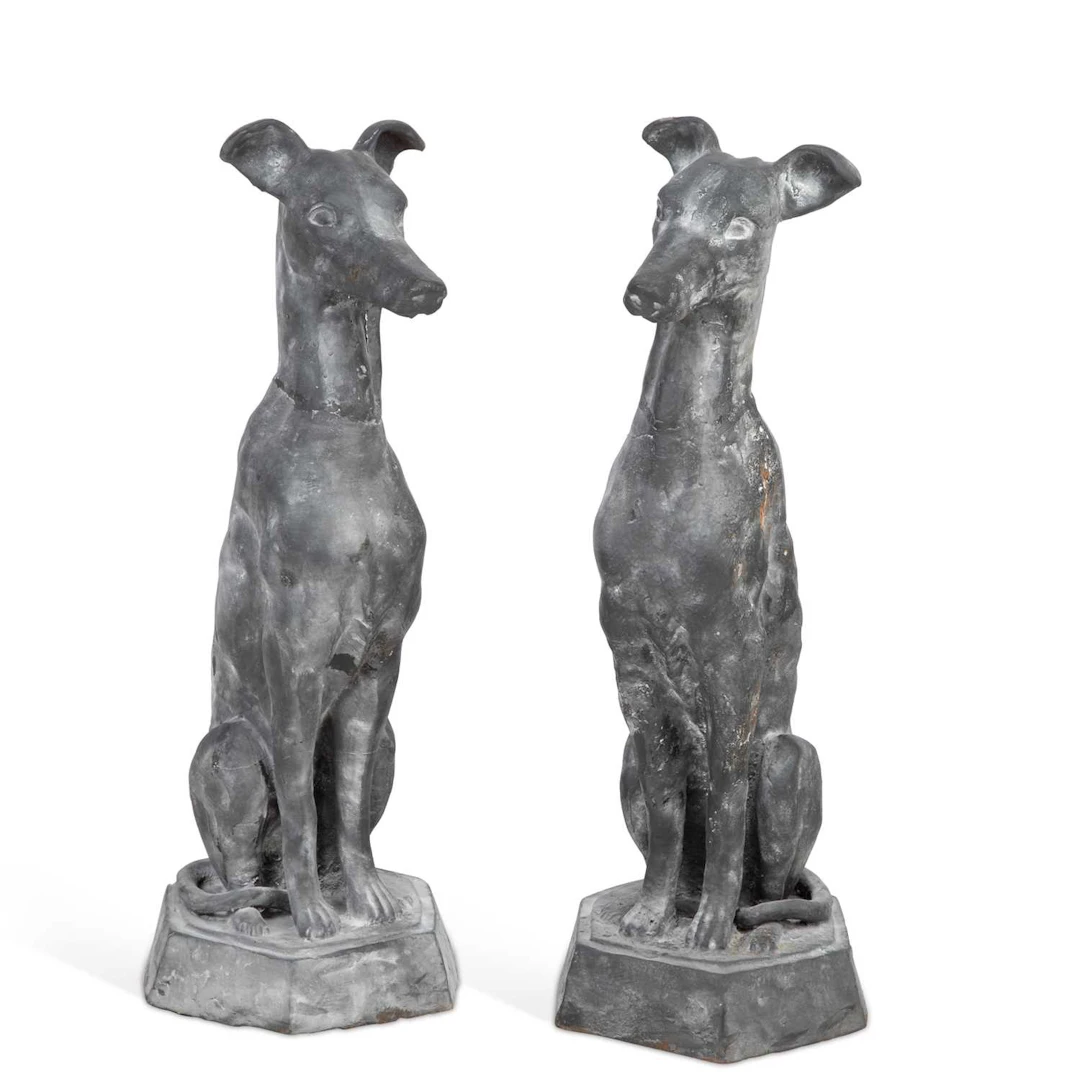 A PAIR OF CAST METAL MODELS OF SEATED WHIPPETS