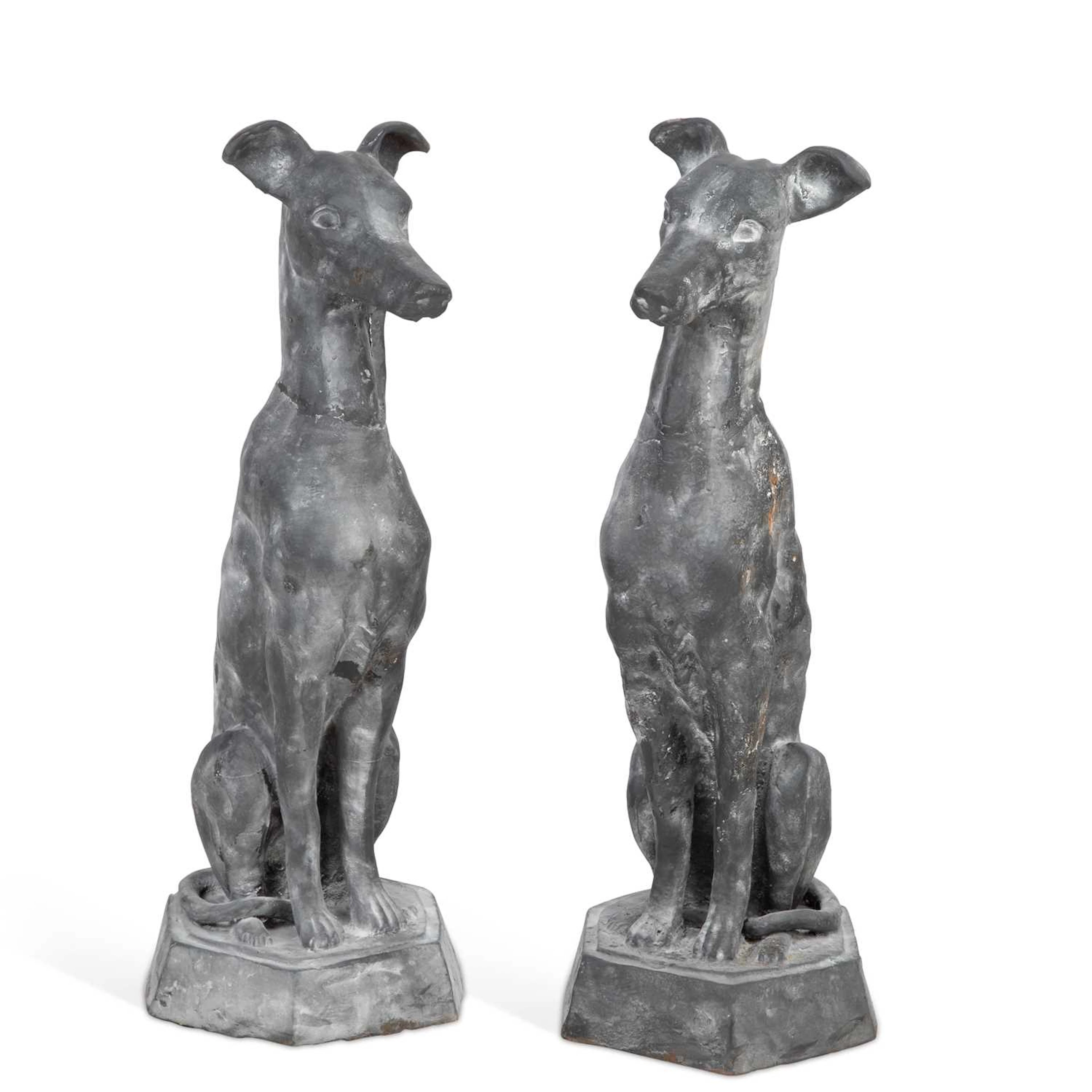 A PAIR OF CAST METAL MODELS OF SEATED WHIPPETS