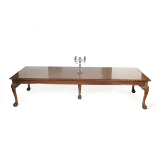 A LARGE MAHOGANY DINING TABLE
