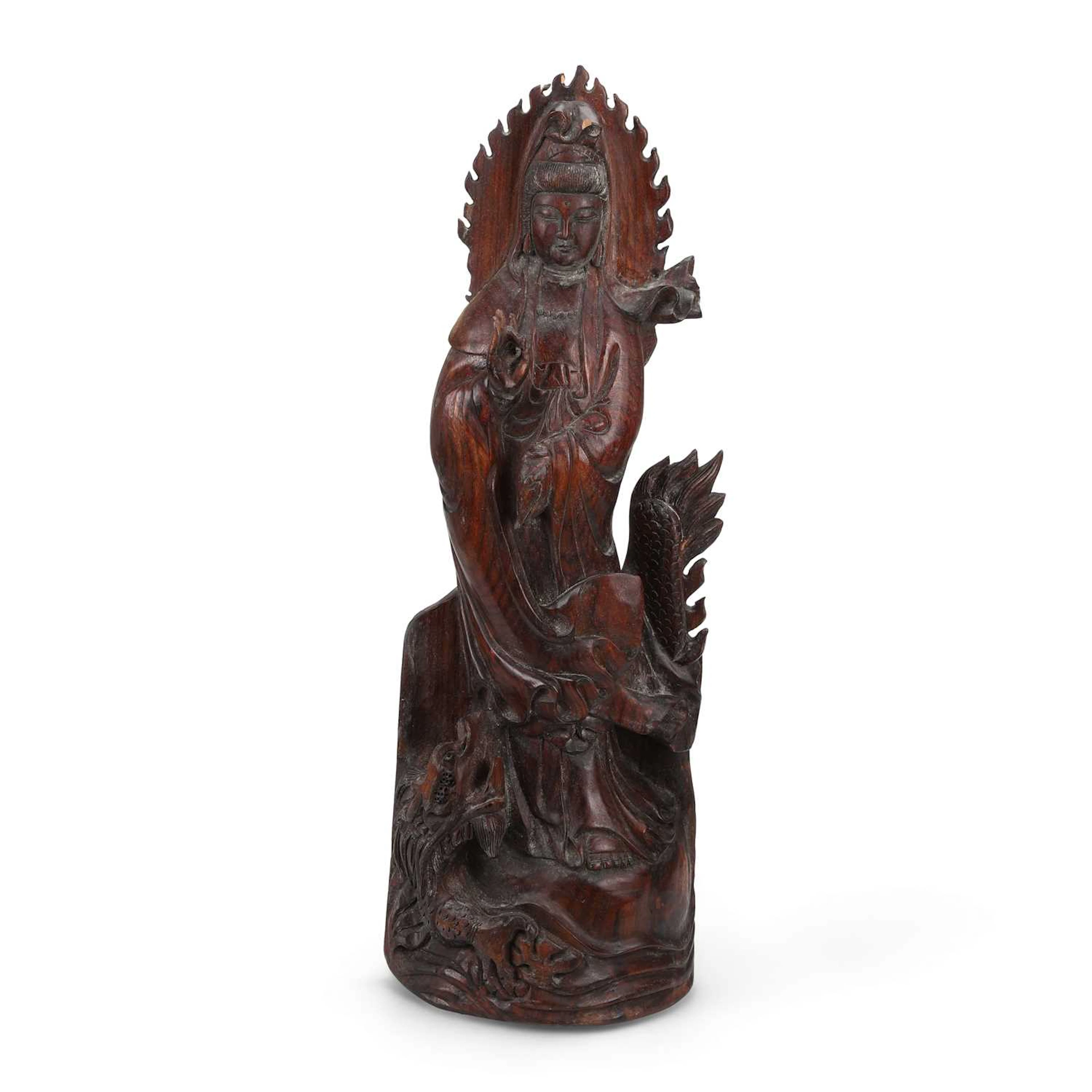 A CHINESE CARVED HARDWOOD FIGURE OF GUANYIN