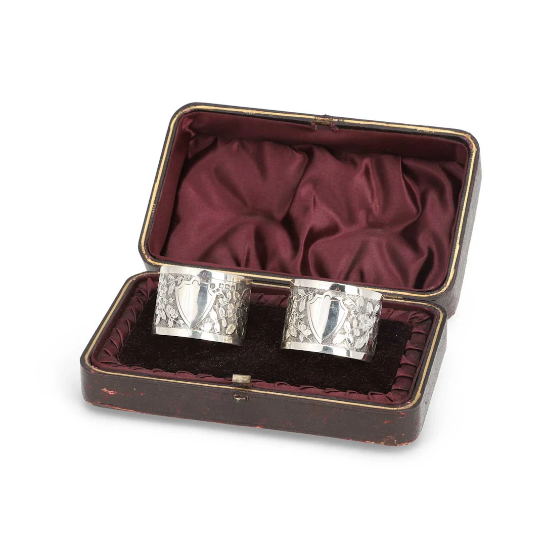 A PAIR OF LATE VICTORIAN SILVER NAPKIN RINGS