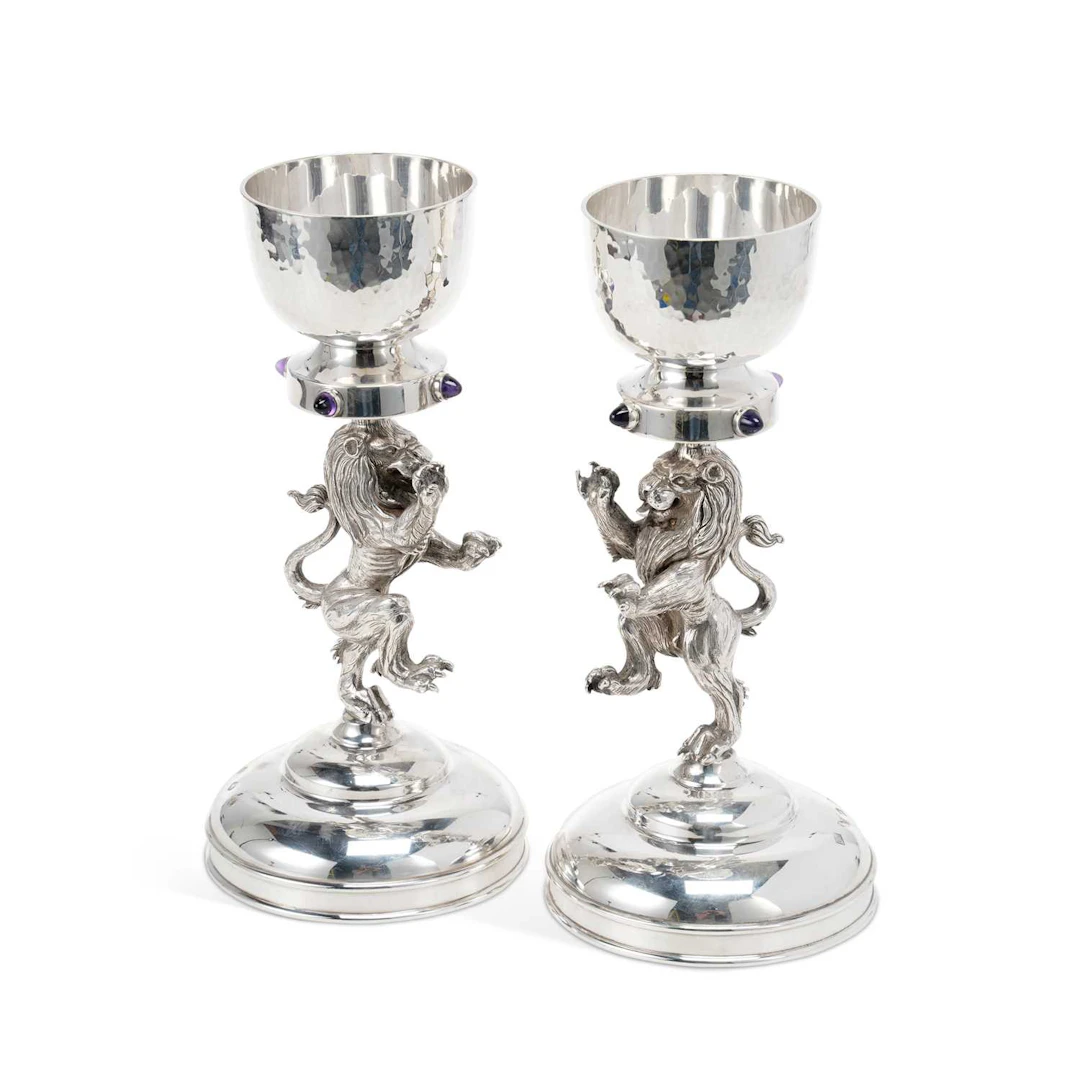 A PAIR OF ELIZABETH II SCOTTISH SILVER FIGURAL CANDLESTICKS