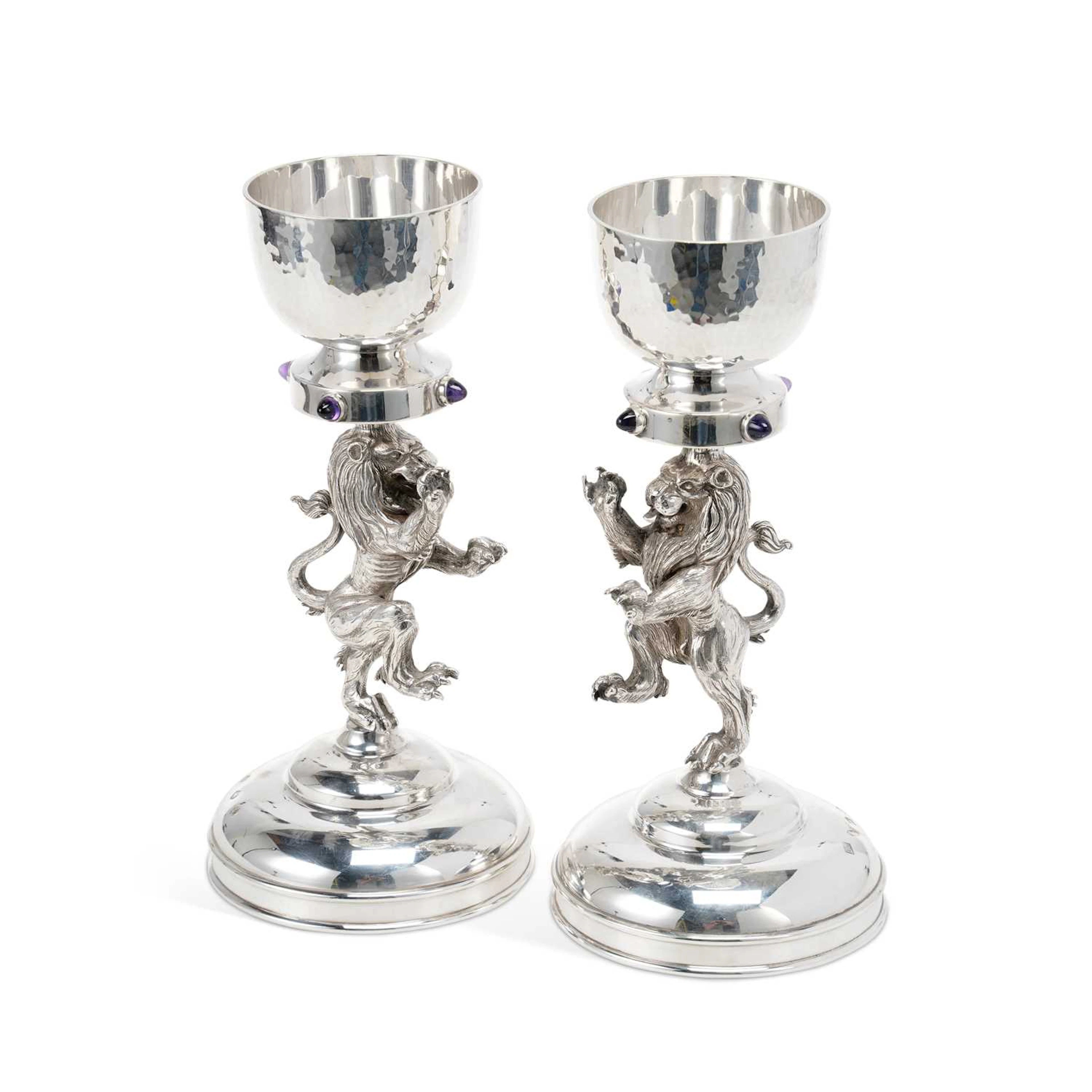 A PAIR OF ELIZABETH II SCOTTISH SILVER FIGURAL CANDLESTICKS