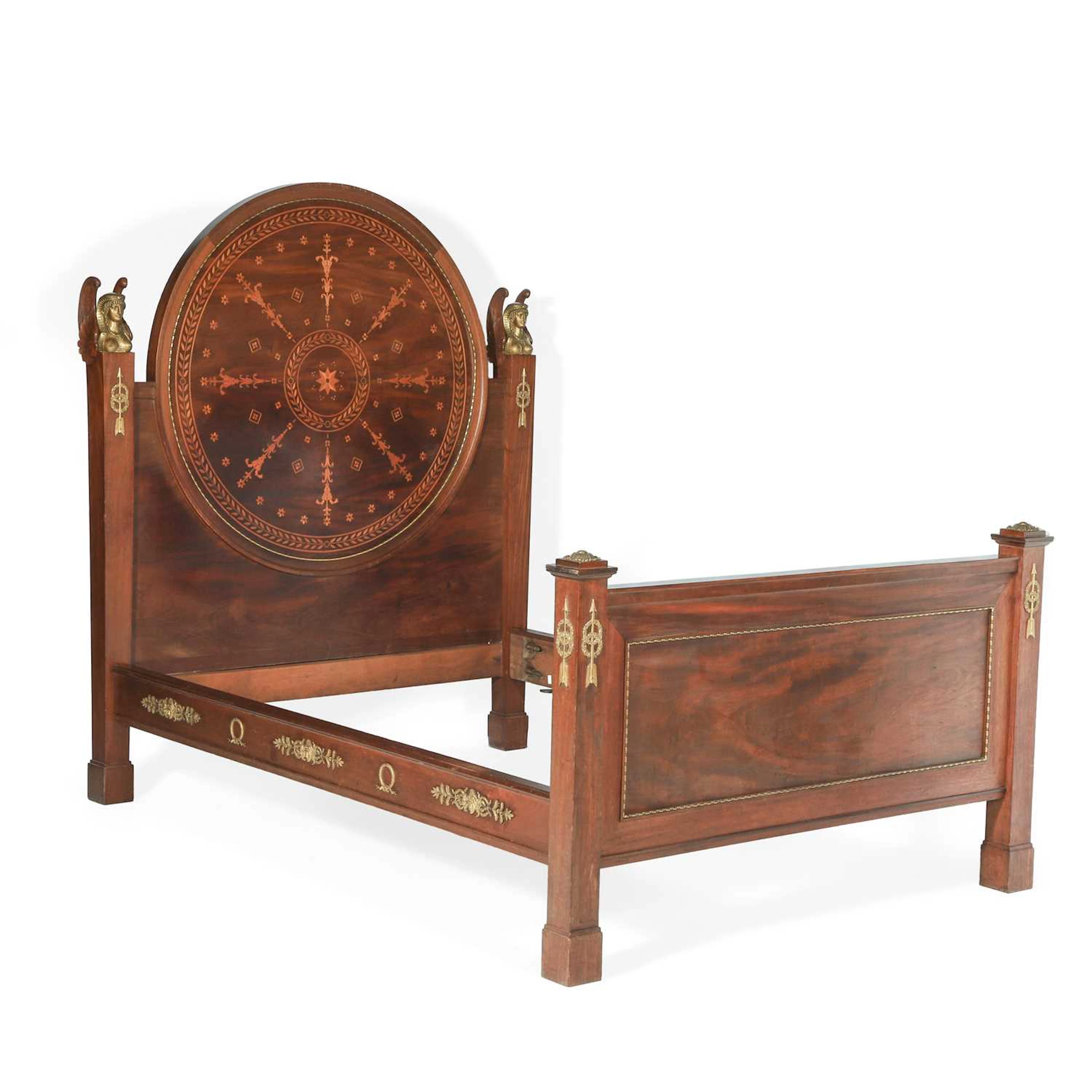 A FRENCH EMPIRE STYLE MAHOGANY AND MARQUETRY ORMOLU MOUNTED BED MANNER