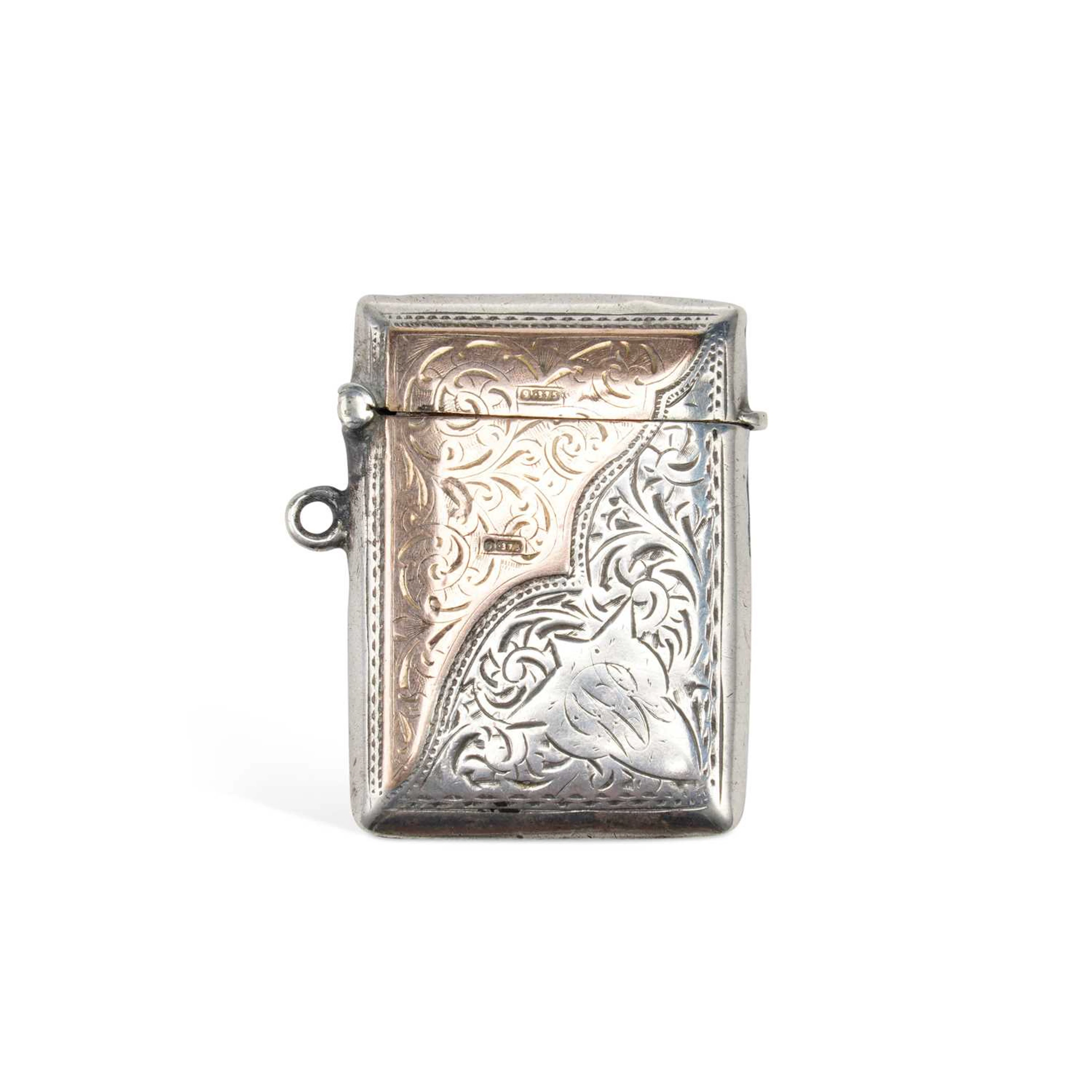 AN EDWARDIAN SILVER AND GOLD VESTA CASE