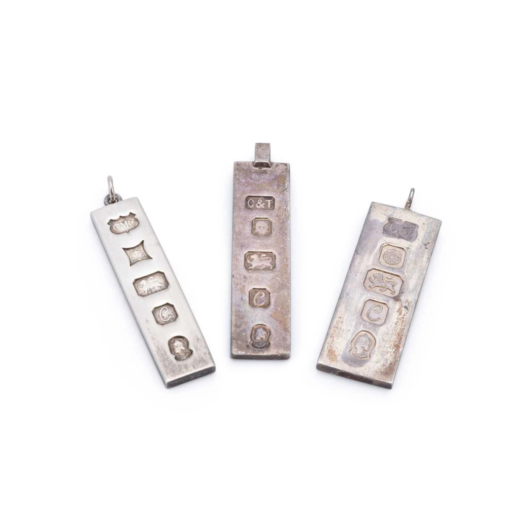 A GROUP OF SILVER PENDANTS