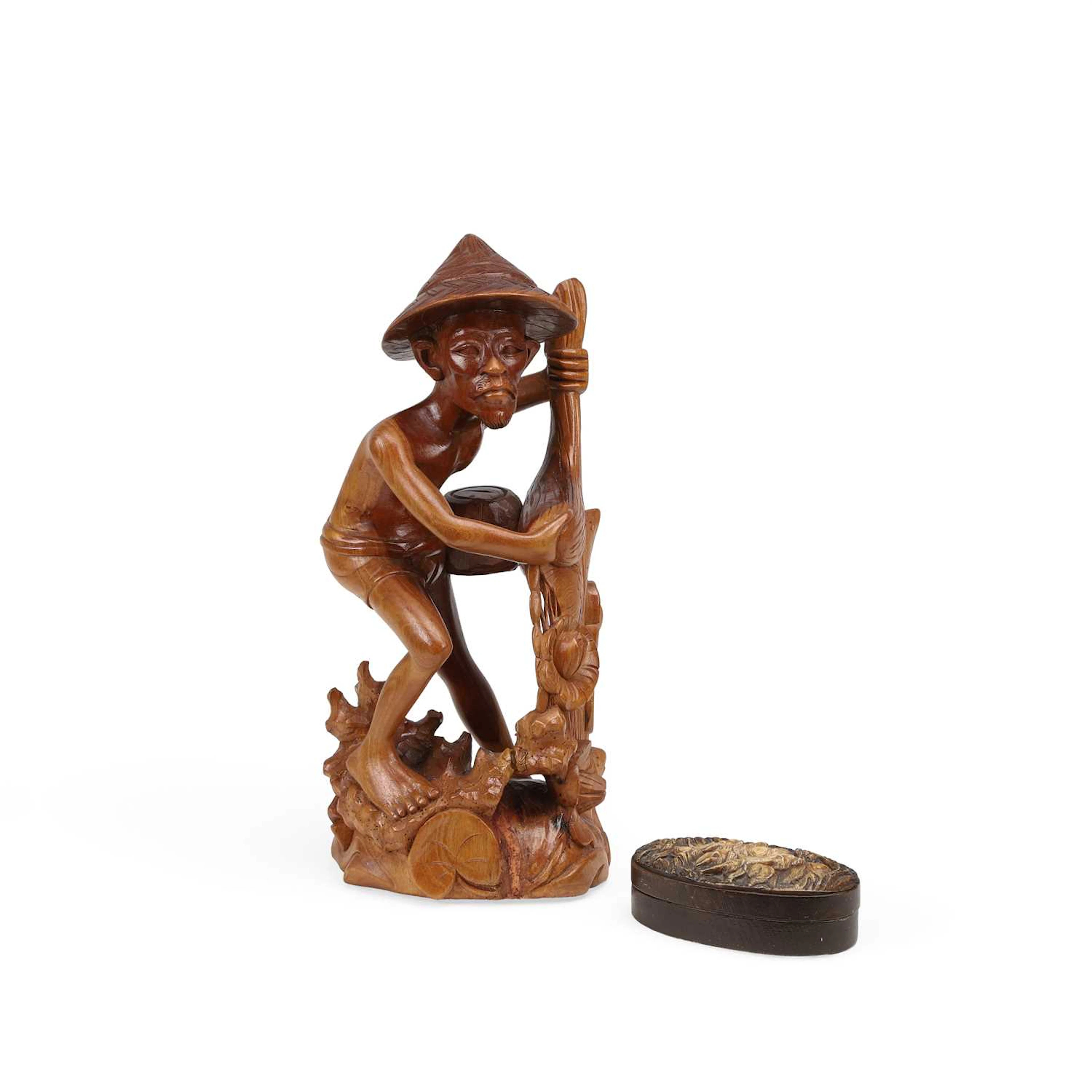 A CARVED WOOD FIGURE OF A FISHERMAN AND A CARVED WOOD BOX