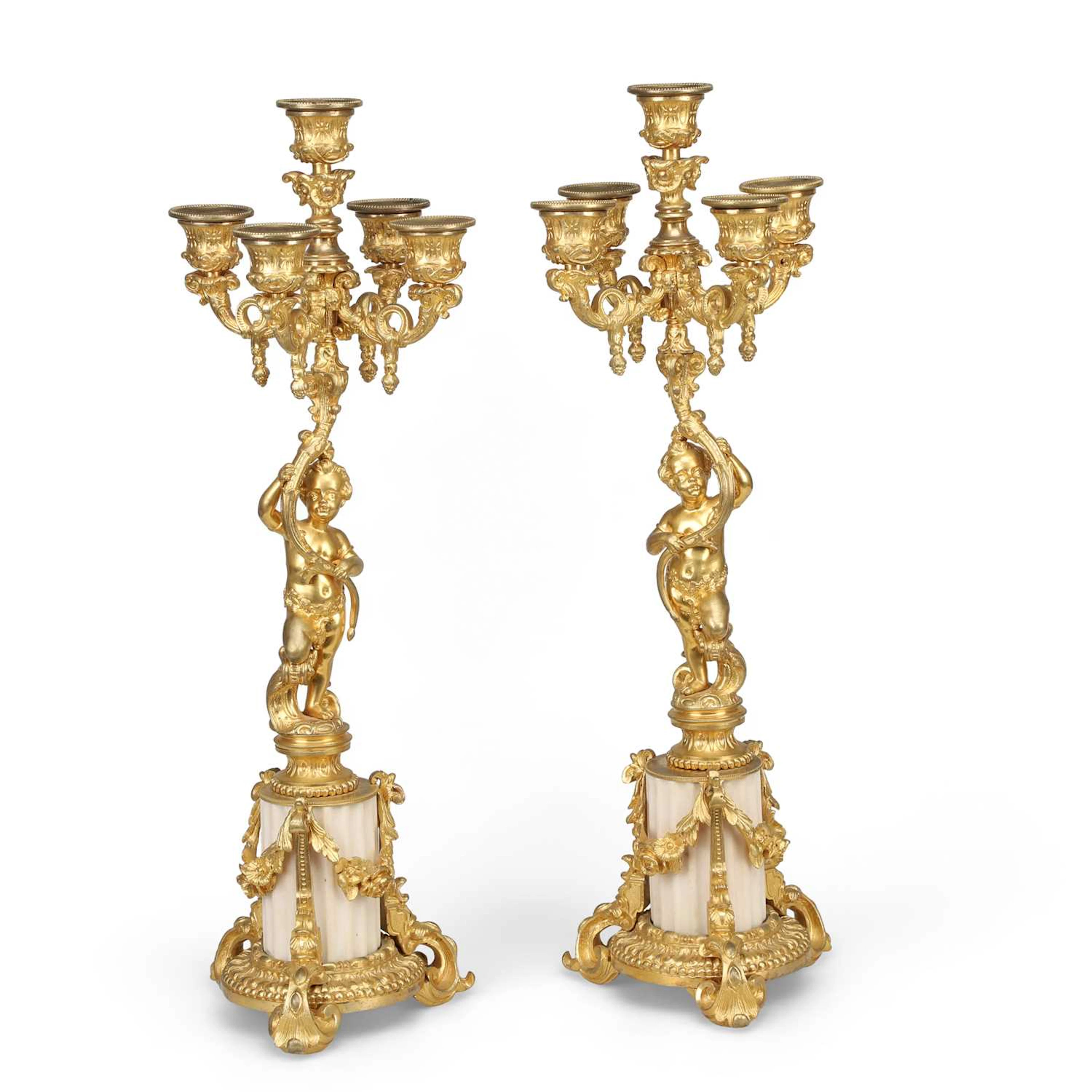 A PAIR OF GILT BRONZE AND WHITE MARBLE FIVE-LIGHT CANDELABRA