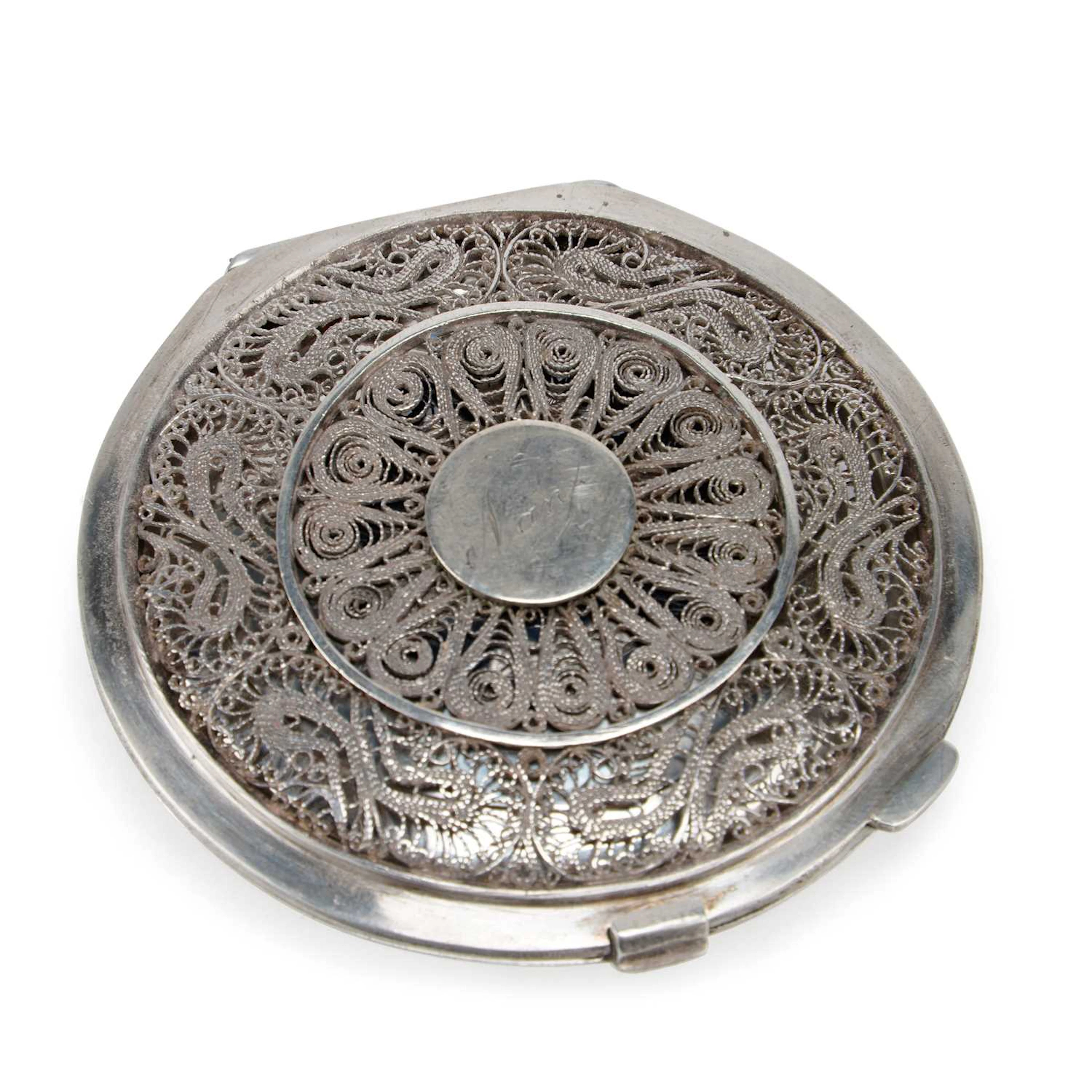 AN IRAQI SILVER AND NIELLO COMPACT