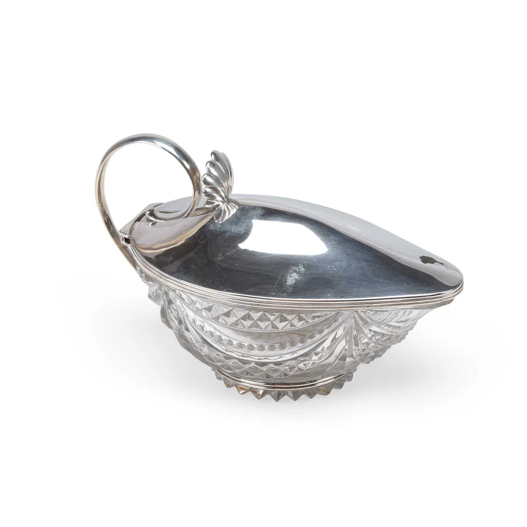 A GEORGE III SILVER-MOUNTED CUT-GLASS SAUCE BOAT