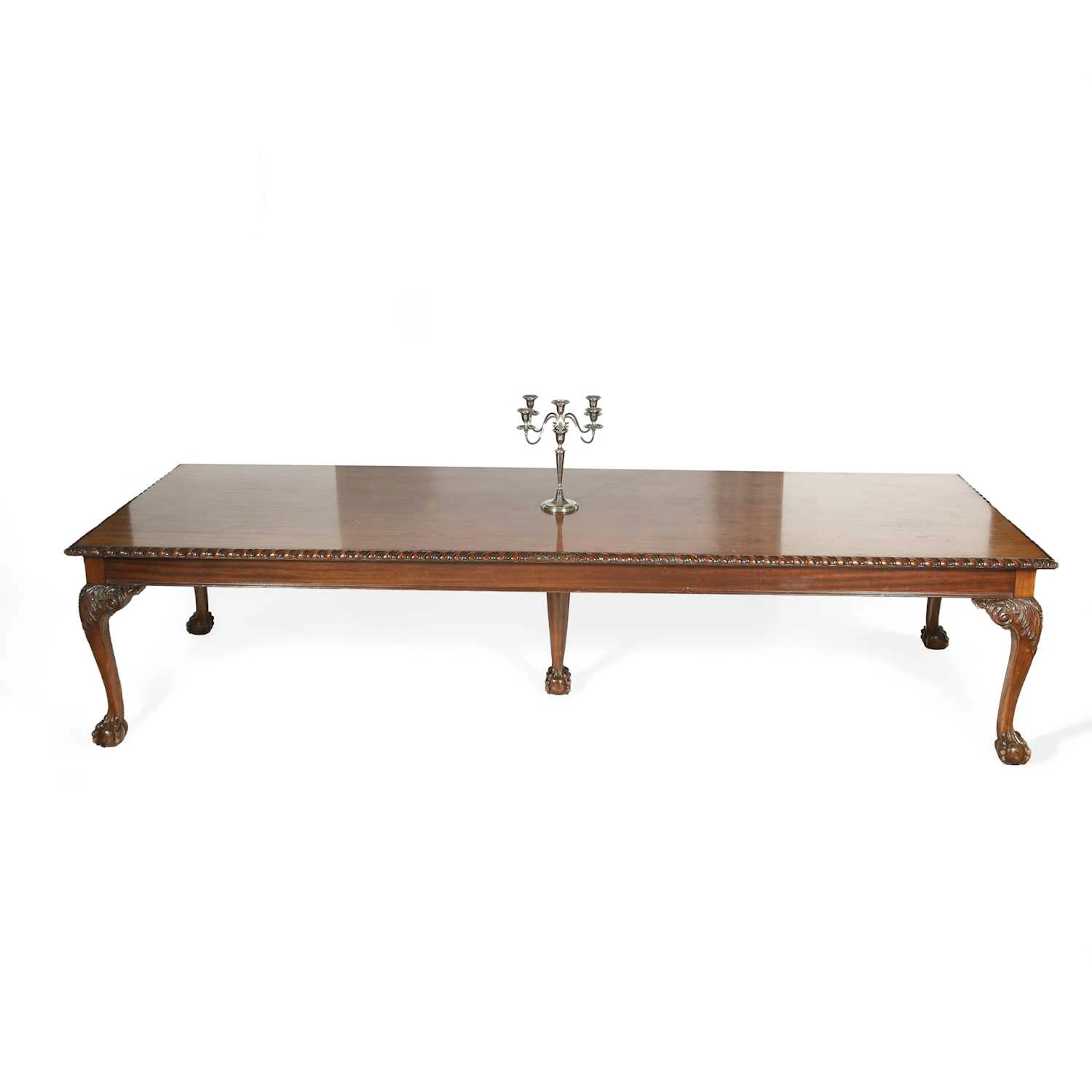 A LARGE MAHOGANY DINING TABLE
