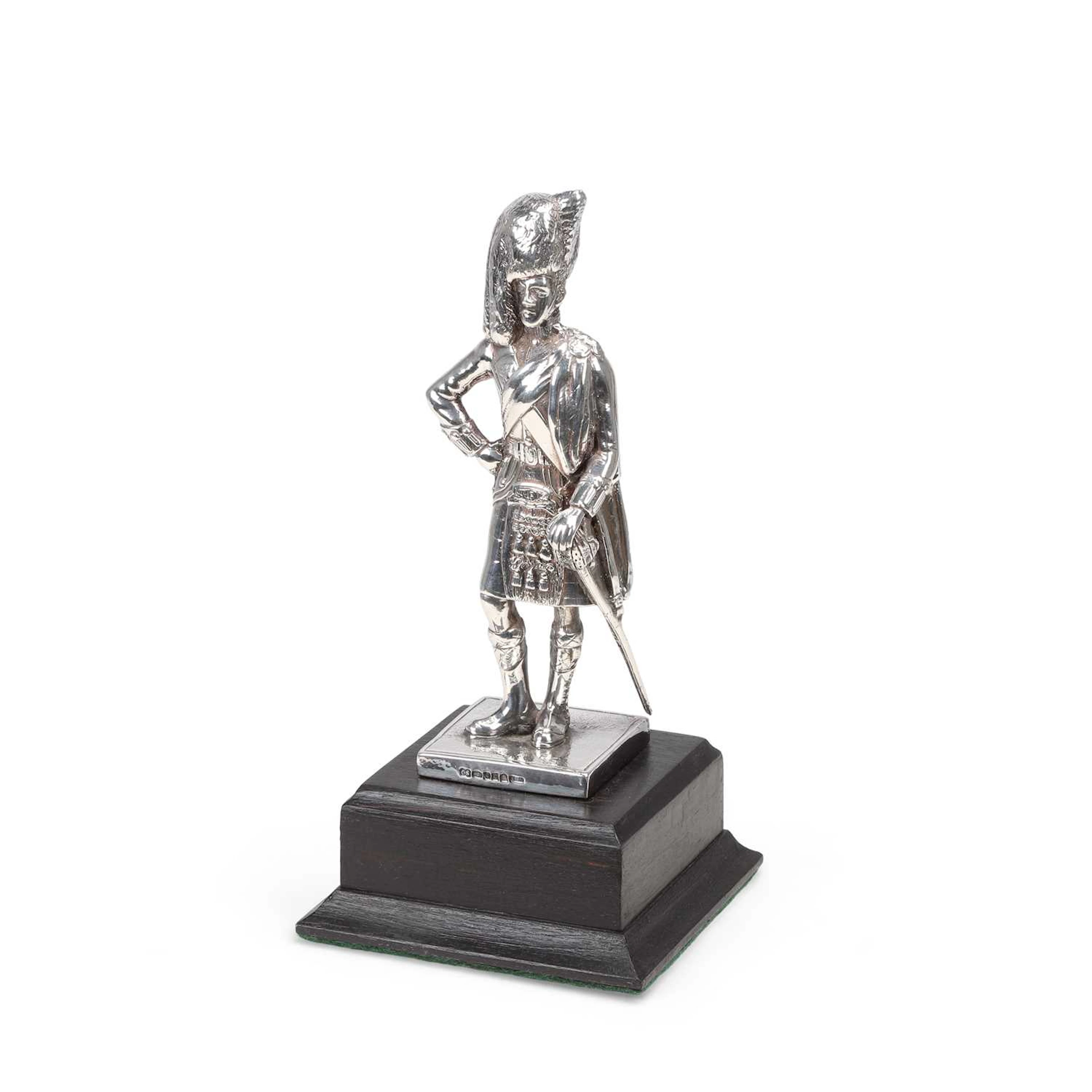 A SILVER FIGURE OF A HIGHLAND OFFICER