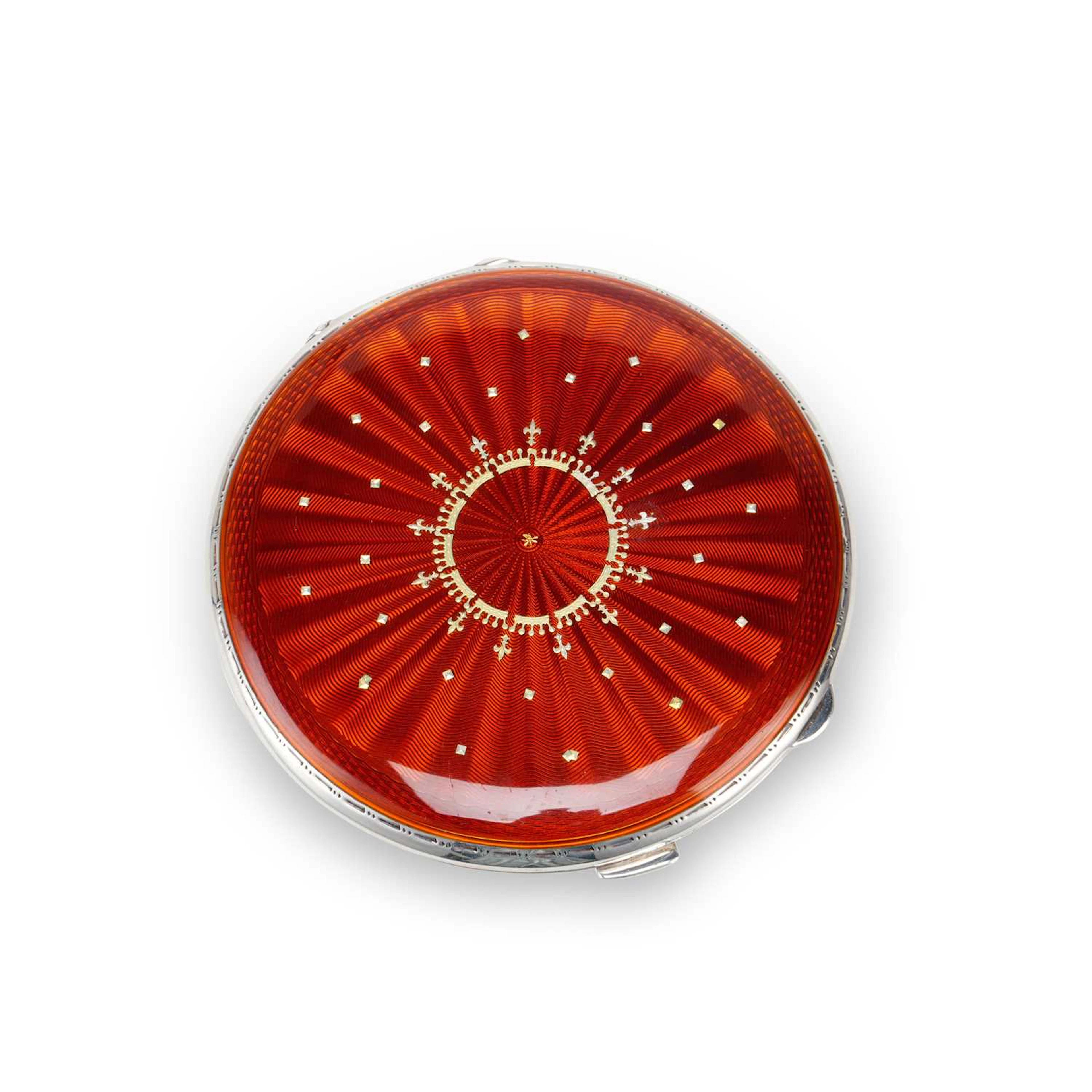 A GEORGE V/ GEORGE VI SILVER AND RED ENAMEL COMPACT