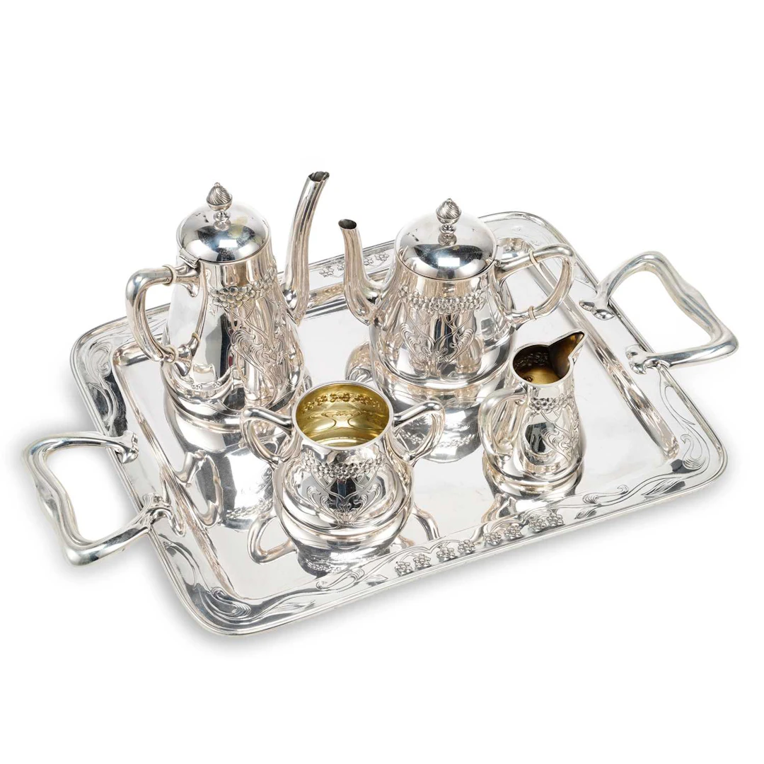 § A SPANISH ART NOUVEAU SILVER FOUR-PIECE TEA SERVICE ON TRAY