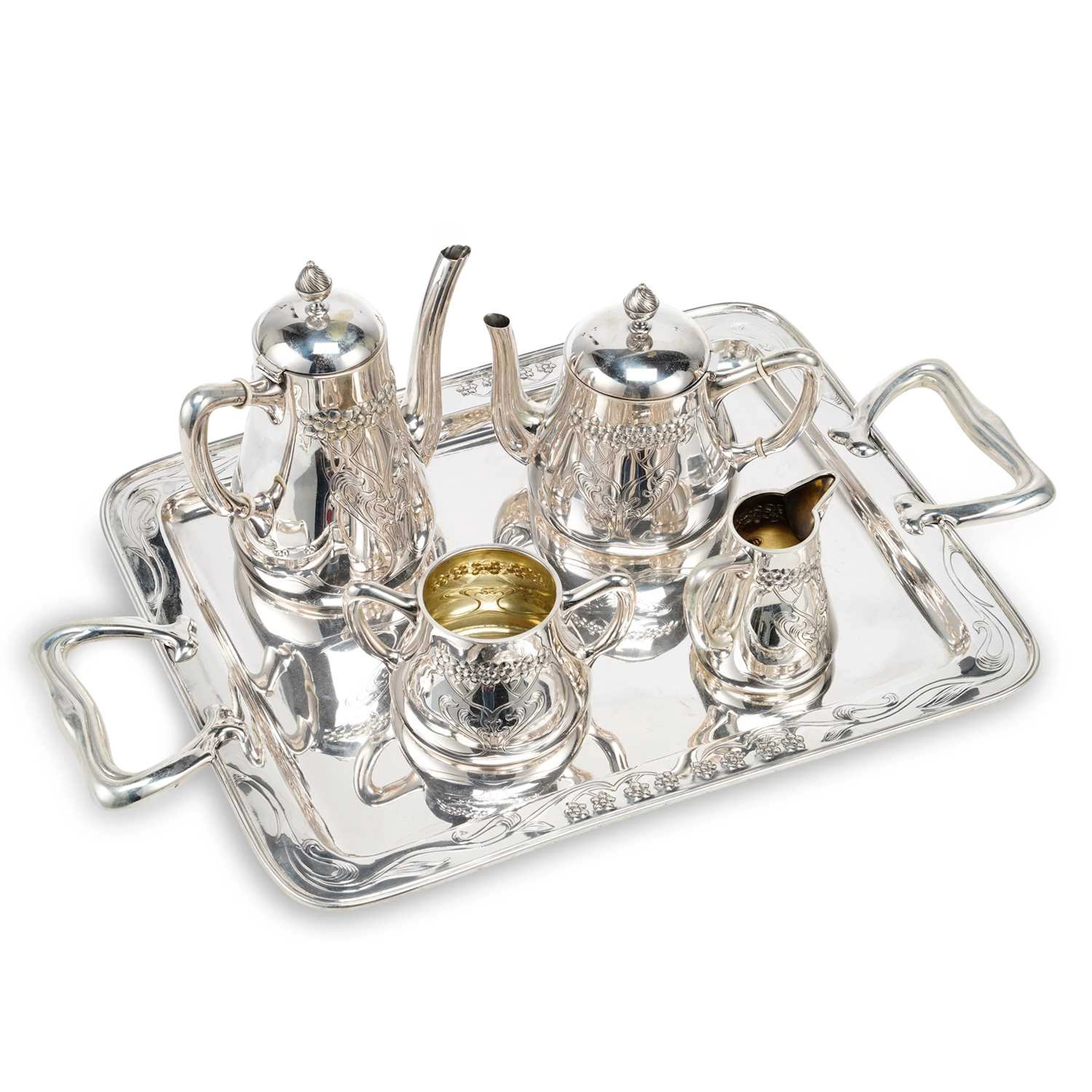 § A SPANISH ART NOUVEAU SILVER FOUR-PIECE TEA SERVICE ON TRAY