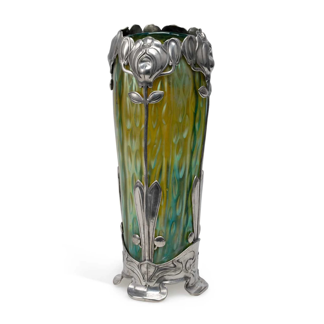 AN ART NOUVEAU IRIDESCENT GREEN GLASS VASE WITH PEWTER MOUNTS