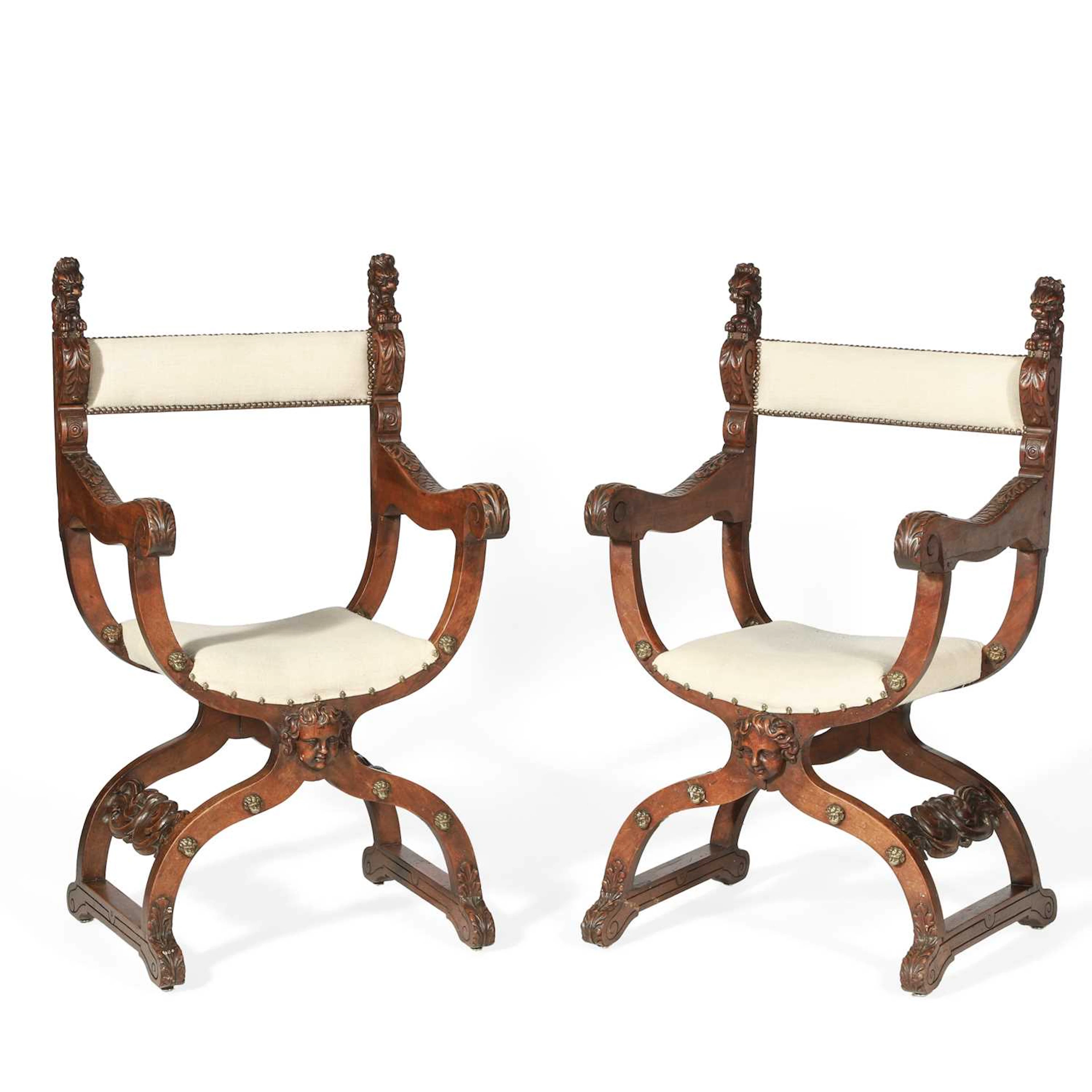 A PAIR OF ITALIAN WALNUT SAVONAROLA ARMCHAIRS