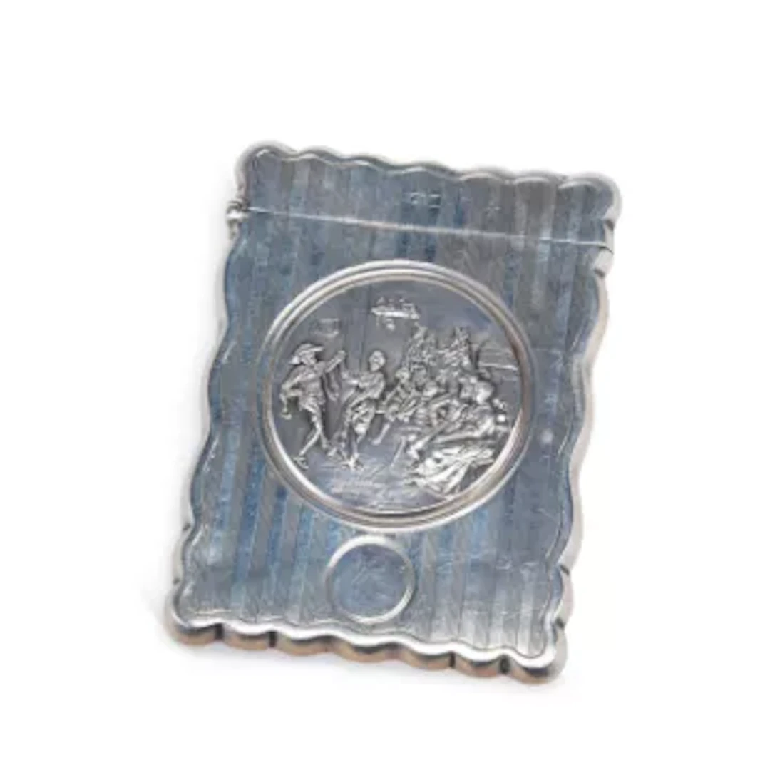 AN EDWARDIAN SILVER CARD CASE
