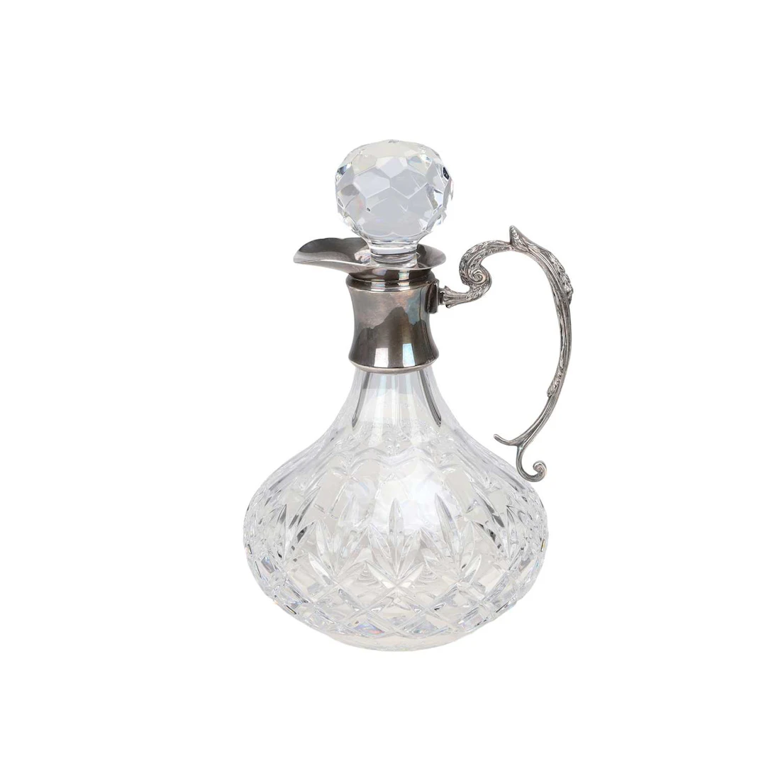 A SILVER-MOUNTED CUT-GLASS CLARET JUG