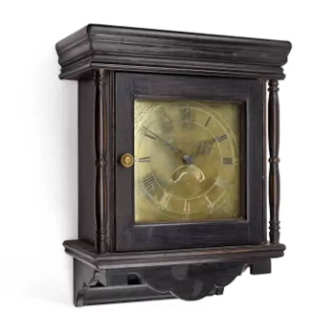 AN EBONISED THIRTY-HOUR WALL CLOCK / AN OAK THIRTY-HOUR WALL CLOCK