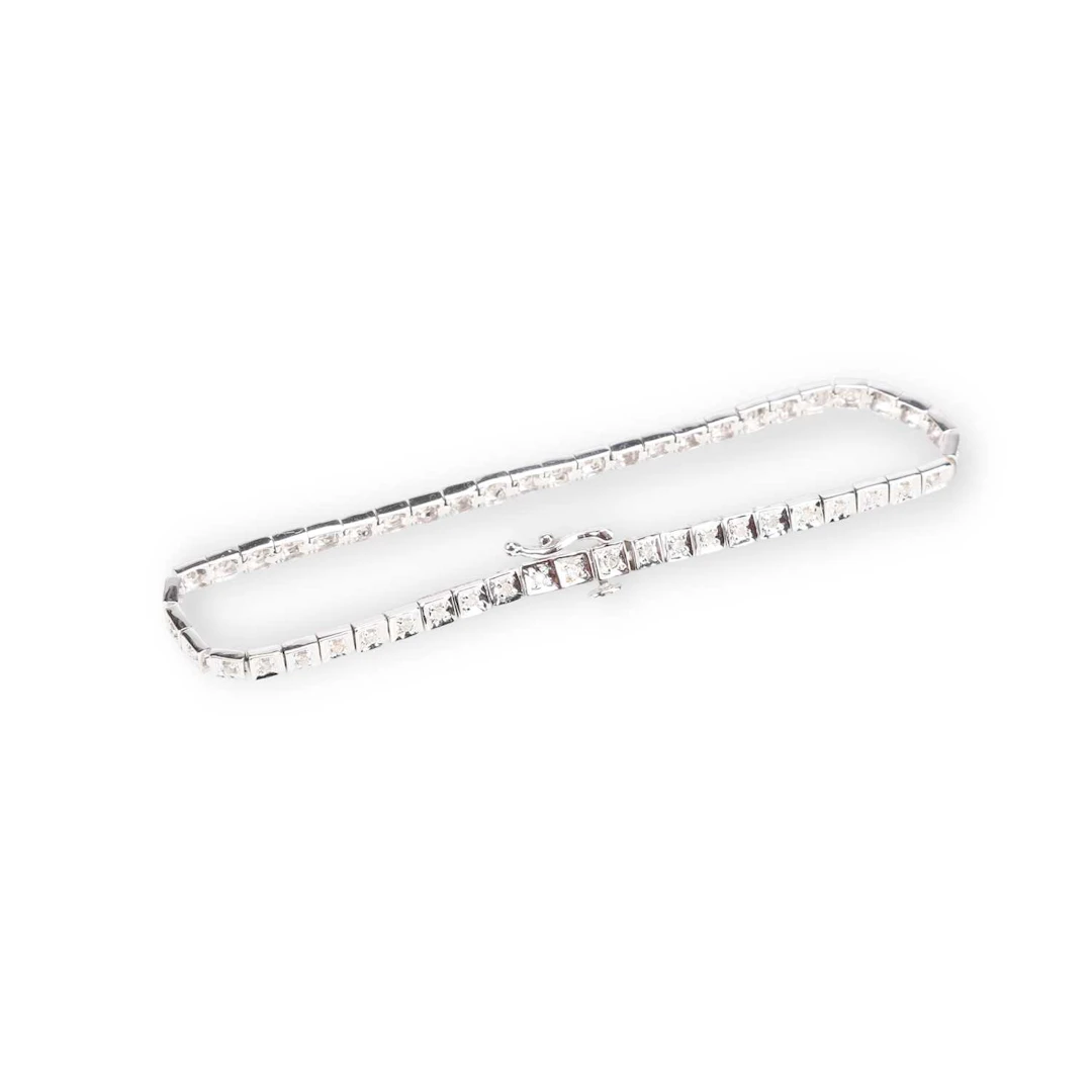 A 9 CARAT WHITE GOLD DIAMOND LINE BRACELET