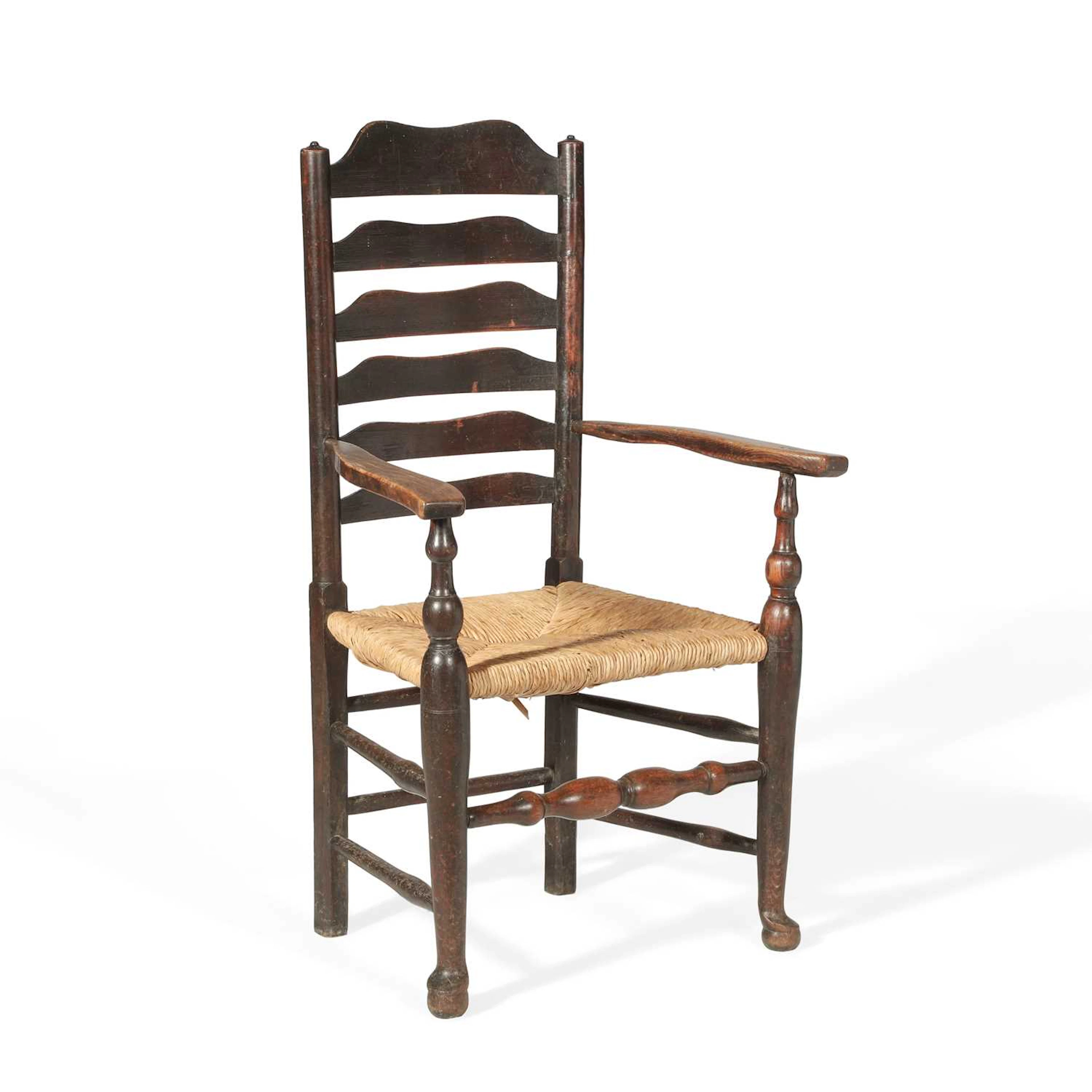 AN OAK LADDERBACK ARMCHAIR
