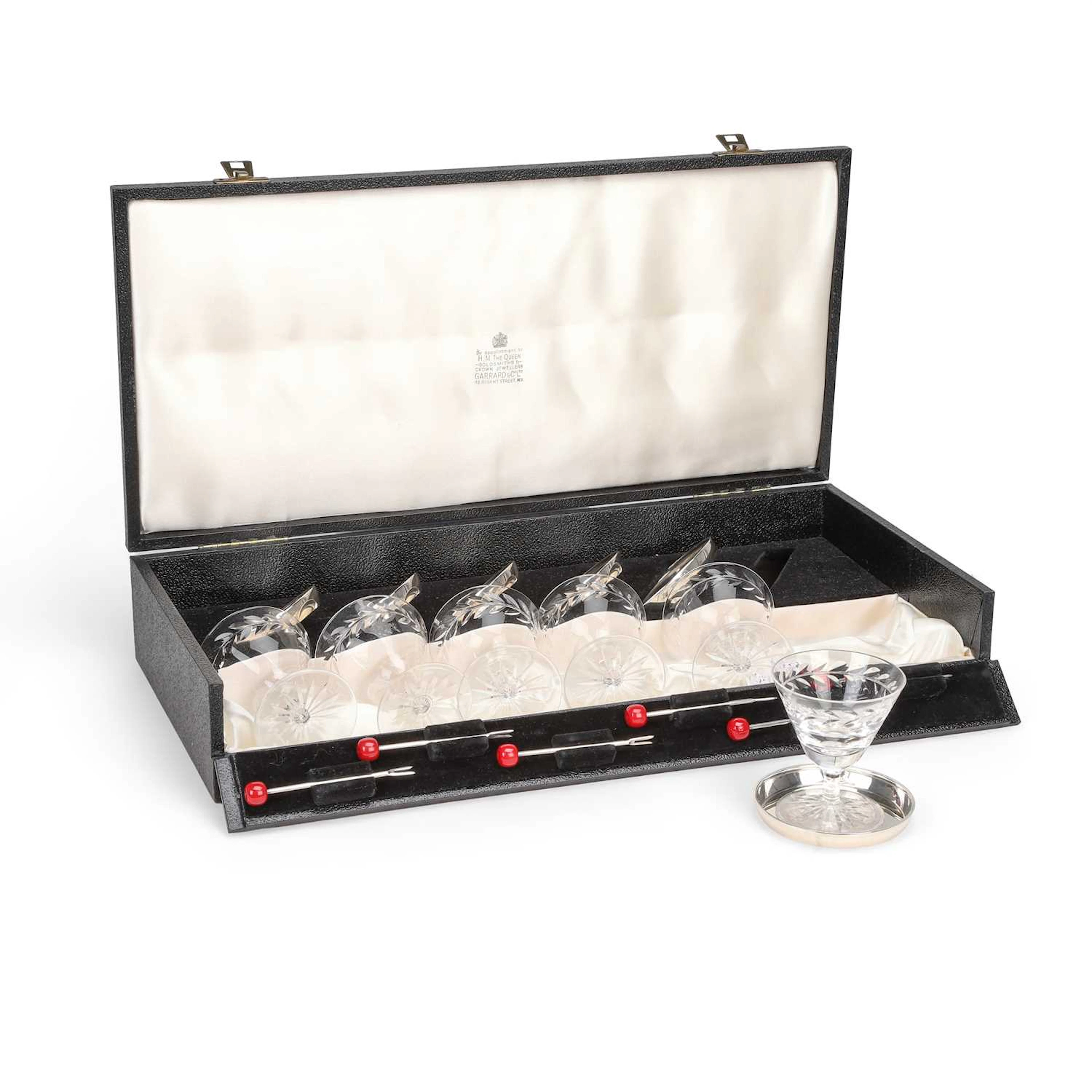 A CASED ELIZABETH II SILVER AND CUT-GLASS COCKTAIL SET