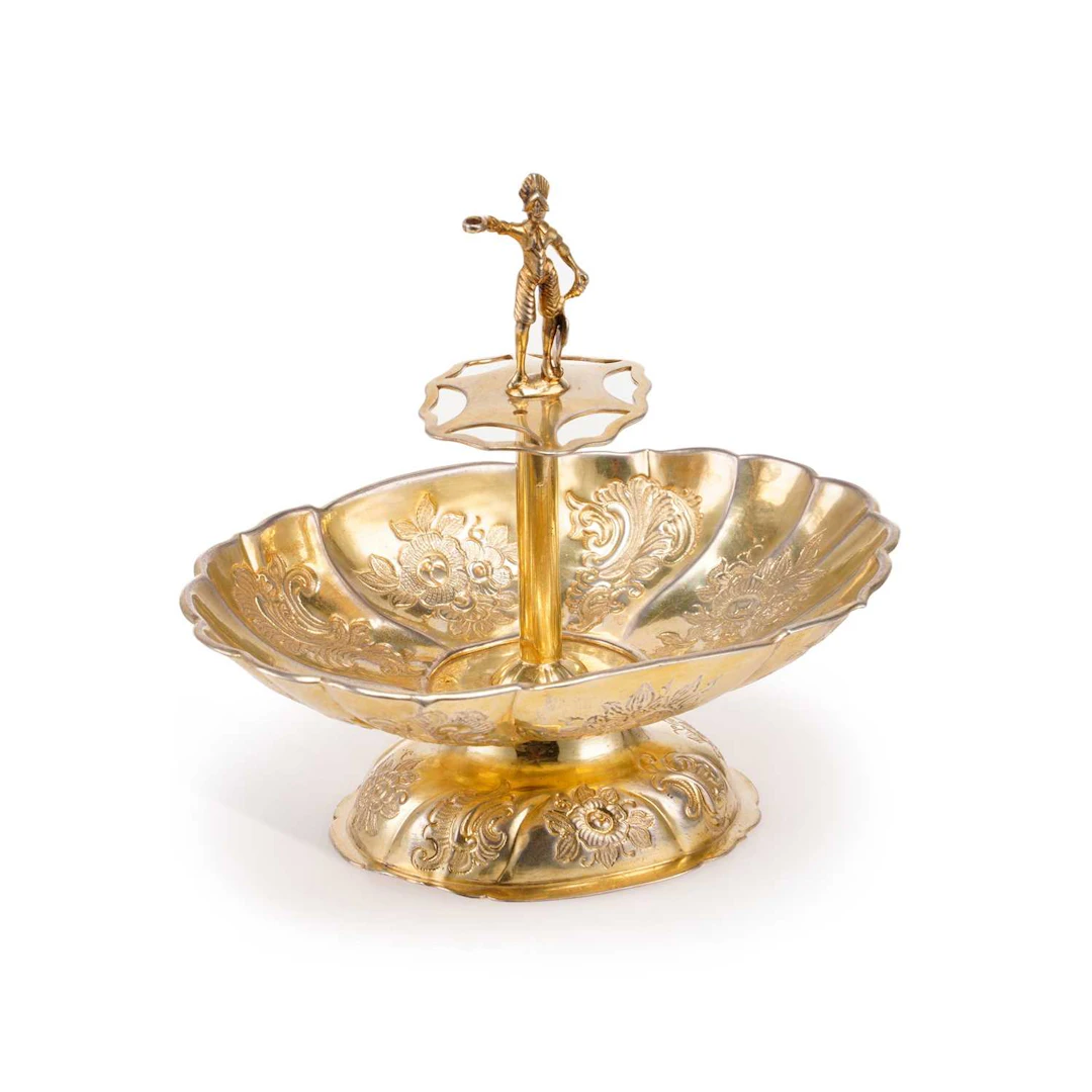 A CONTINENTAL SILVER-GILT FIGURAL SWEETMEAT DISH