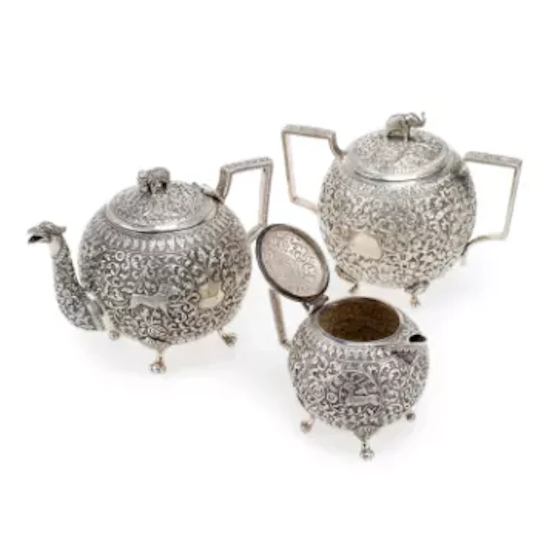 AN INDIAN SILVER MATCHED THREE-PIECE TEA SERVICE