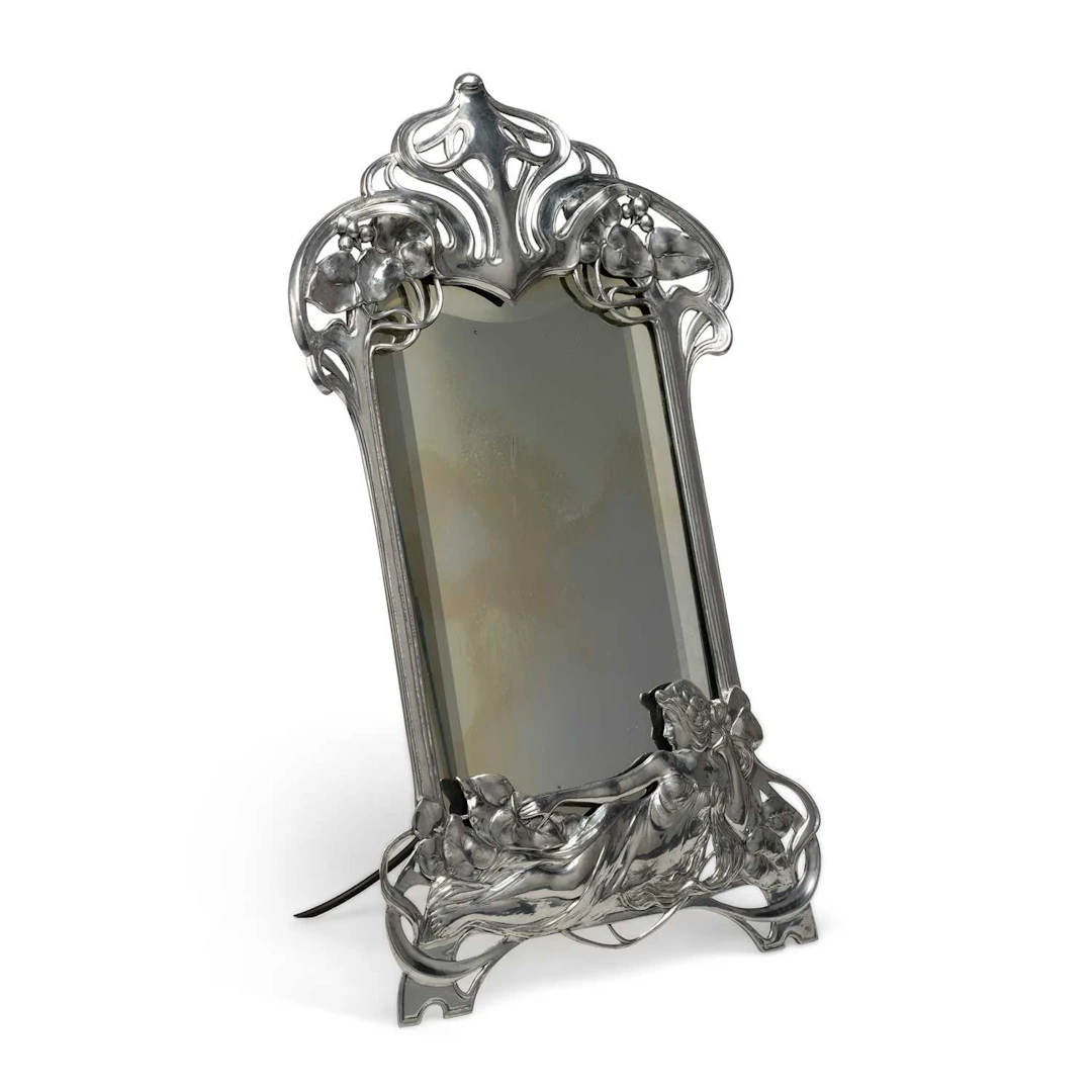 A LARGE ART NOUVEAU SILVER PLATED PEWTER EASEL MIRROR