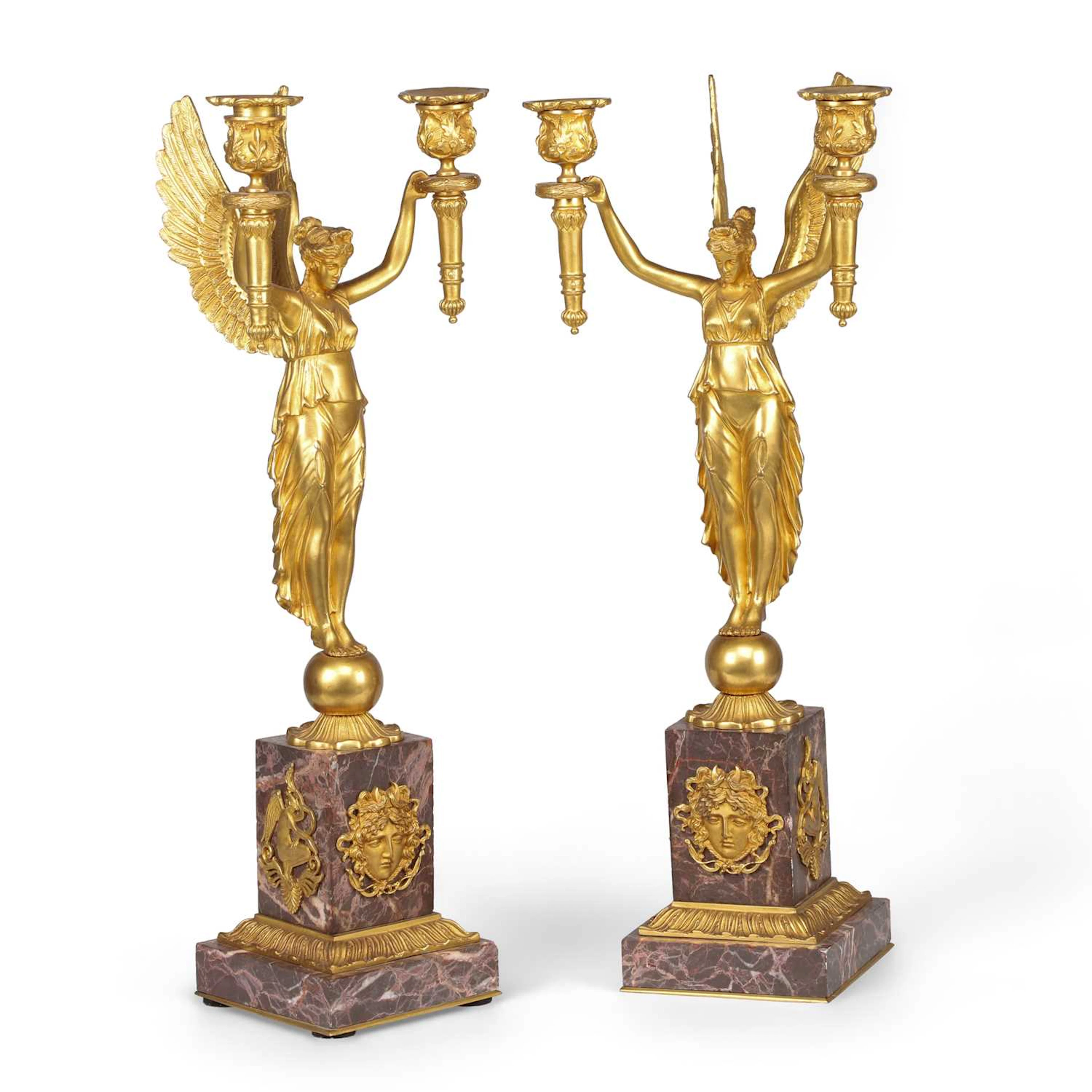 A PAIR OF FRENCH GILT BRONZE AND ROUGE MARBLE FIGURAL CANDELABRA