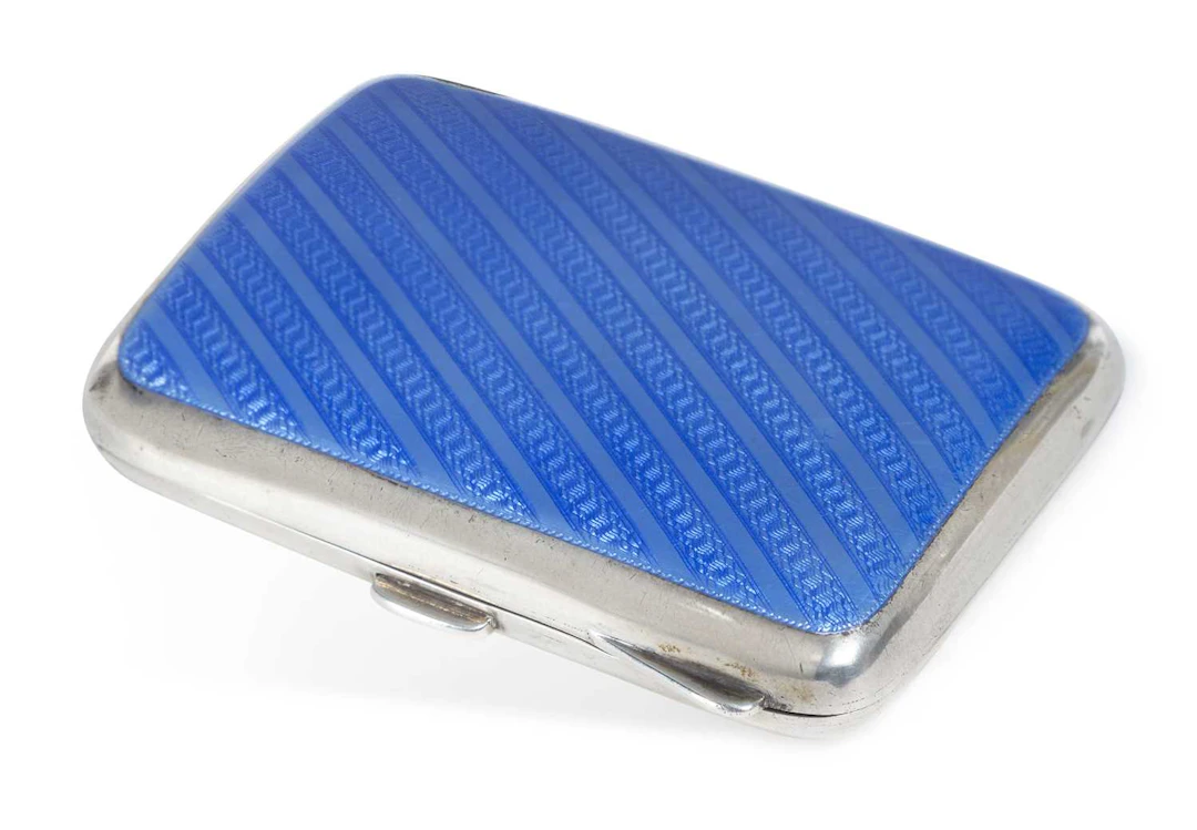 A GEORGE V SILVER AND ENAMEL CIGARETTE CASE
