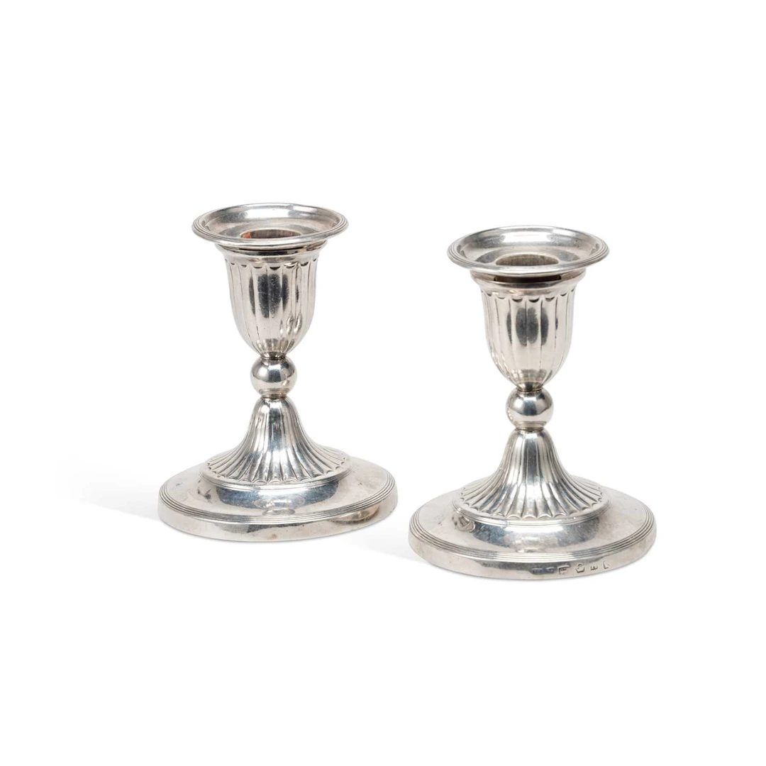 A PAIR OF GEORGE III SILVER DWARF CANDLESTICKS