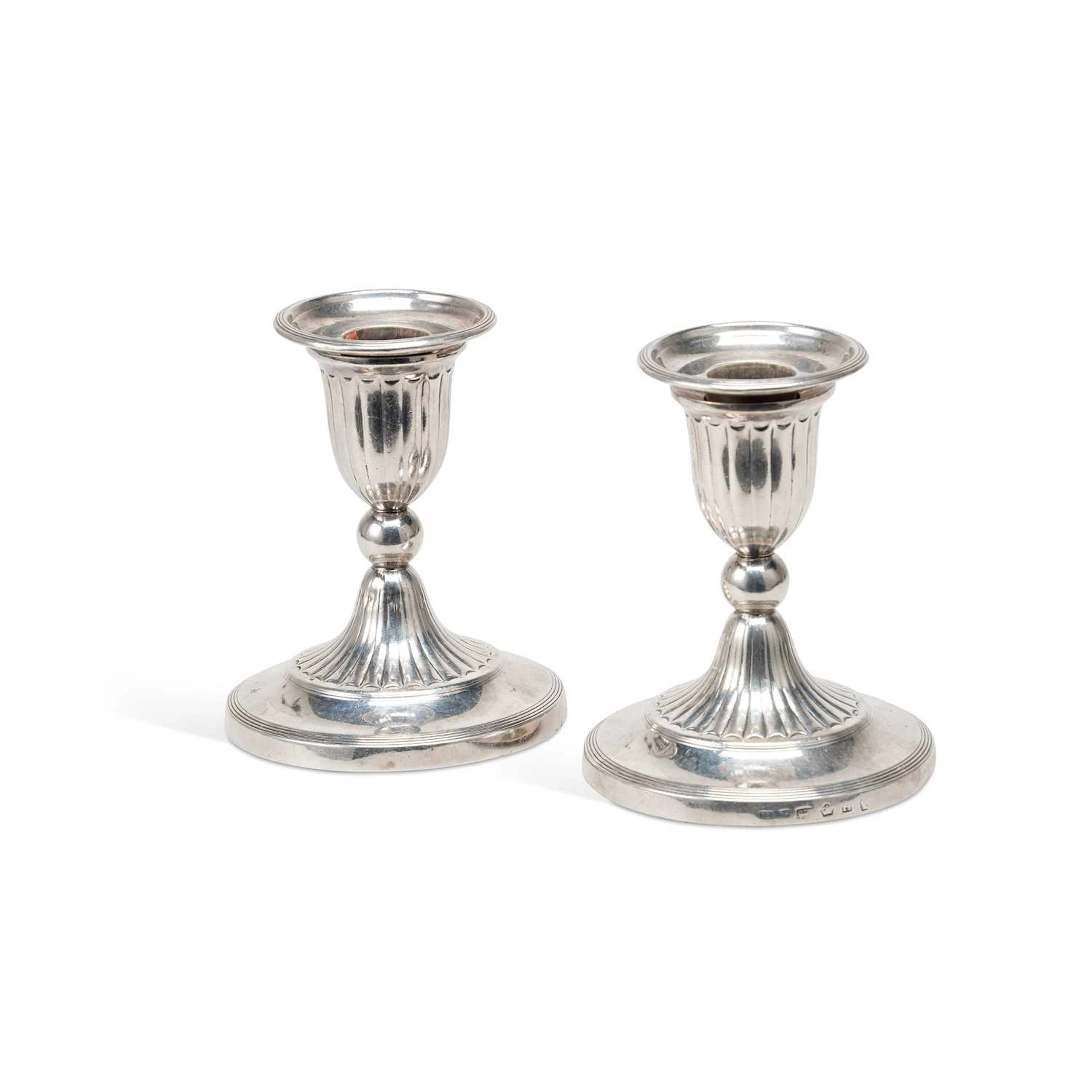 A PAIR OF GEORGE III SILVER DWARF CANDLESTICKS