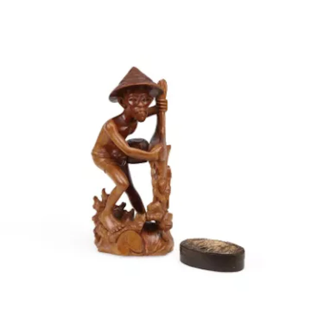 A CARVED WOOD FIGURE OF A FISHERMAN AND A CARVED WOOD BOX