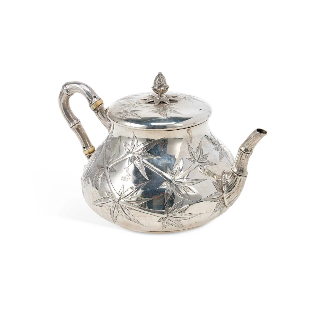 § A VICTORIAN SILVER CHINOISERIE TEAPOT