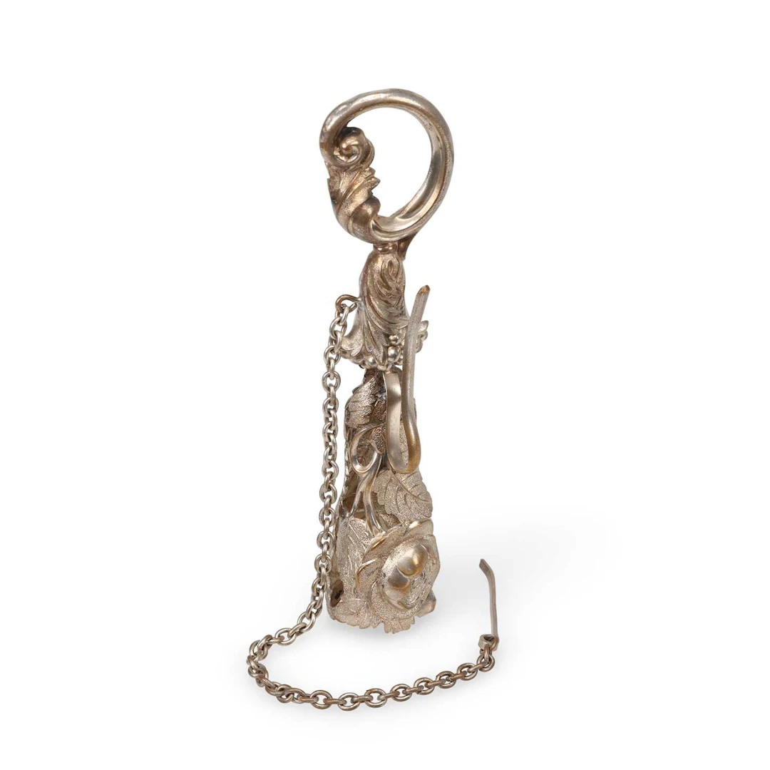 A VICTORIAN SILVERED METAL POSY HOLDER