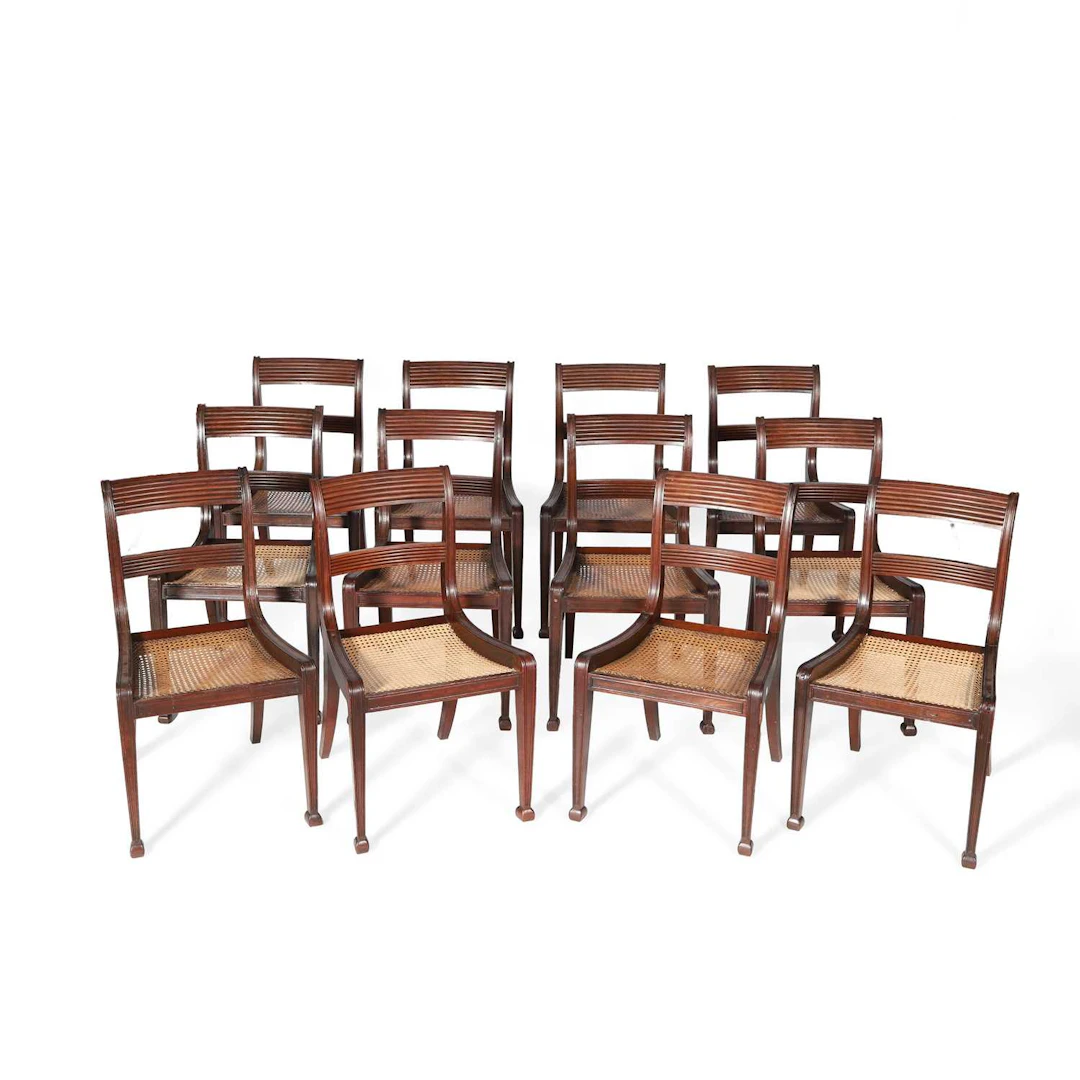 A SET OF TWELVE REGENCY MAHOGANY DINING CHAIRS