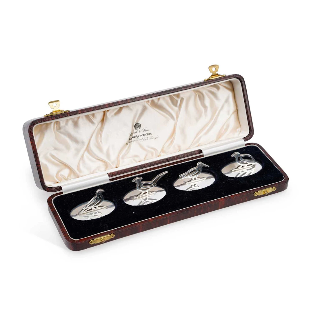 A SCOTTISH SET OF FOUR SILVER ANIMAL MENU HOLDERS