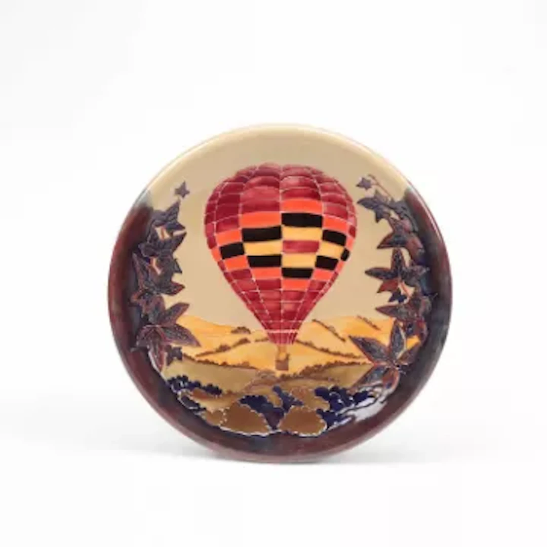 A LIMITED EDITION 'HOT AIR BALLOON' PATTERN CHARGER SALLY TUFFIN FOR MOORCROFT